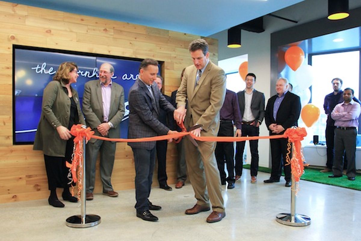 Today&#8217;s Office Ribbon Cutting: Continuum CEO Michael George (left) and Jay Ash (r.), secretary of Housing and Economic Development for the Commonwealth of Massachusetts.