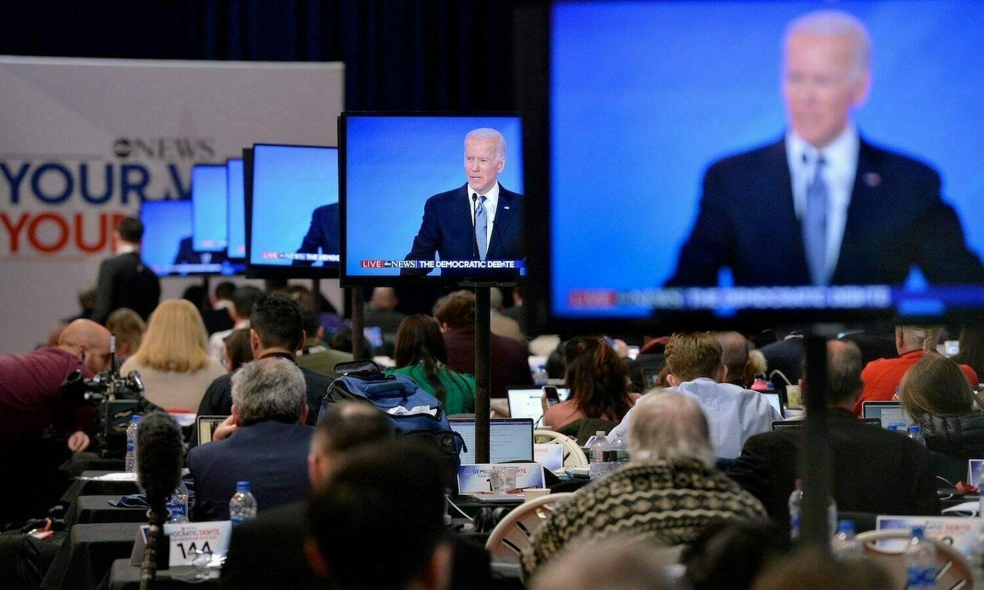 Democratic presidential hopeful former Vice President Joe Biden is seen on screens in the spin room during the eighth Democratic primary debate of the 2020 presidential campaign season. (JOSEPH PREZIOSO/AFP via Getty Images)