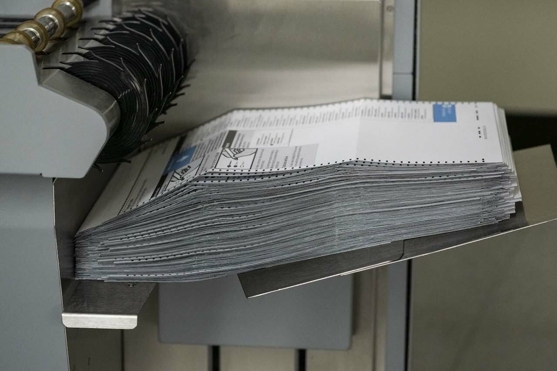 Ballots are seen in a machine after the scanning process at the King County Elections headquarters on August 4, 2020 in Renton, Washington. Today’s columnist, ESET’s Cameron Camp, focuses on election security and advises local government officials to solicit the expertise of security pros as we head into the fall campaign.  (Photo by David Ryder/Ge...