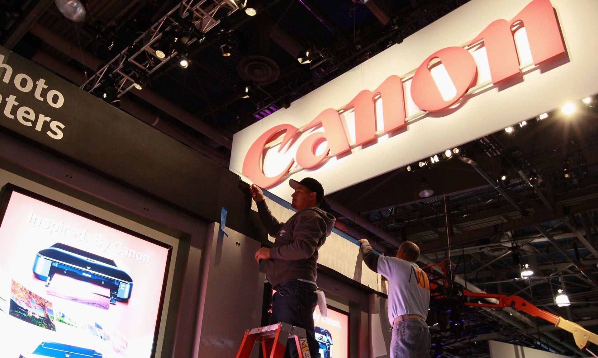 Workers set up the Canon booth before the start of the 2011 CES show in Las Vegas. After a Maze ransomware attack, data stolen from Canon has been leaked online. (Photo by Justin Sullivan/Getty Images)