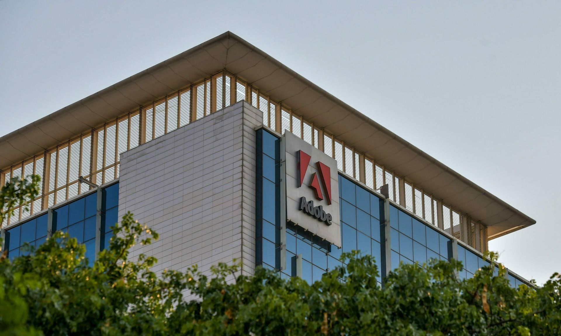 In this photo taken on April 16, 2020, a general view shows the Indian office of Adobe. Since the company ended support for Magento 1, it has become a target of attacks like the massive campaign that affected 2,000 web sites this weekend. (Photo by MANJUNATH KIRAN/AFP via Getty Images)