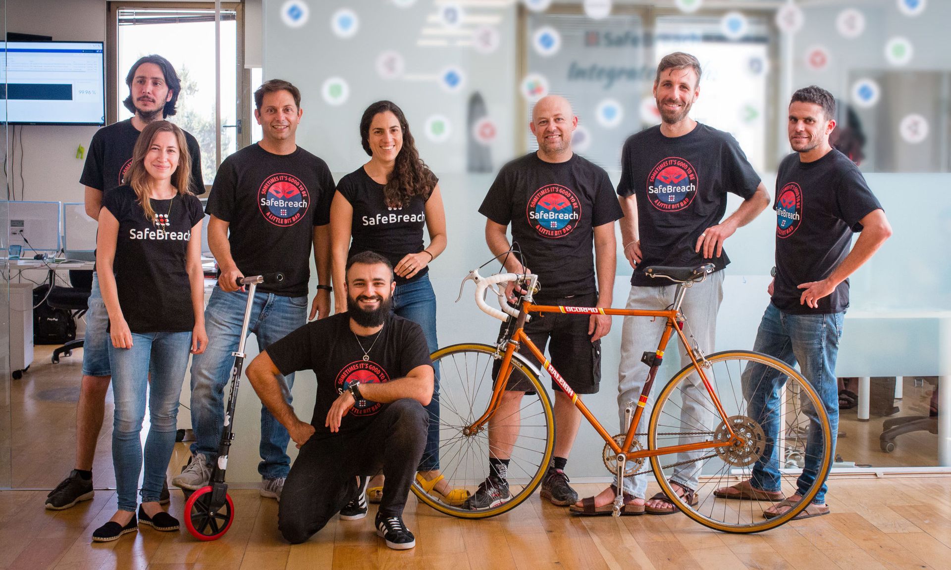 Yael Ben Arie, center, and her team. Ben Arie is the vice president of research and development at Tel Aviv-based SafeBreach, a company specializing in data breach and attack simulations.