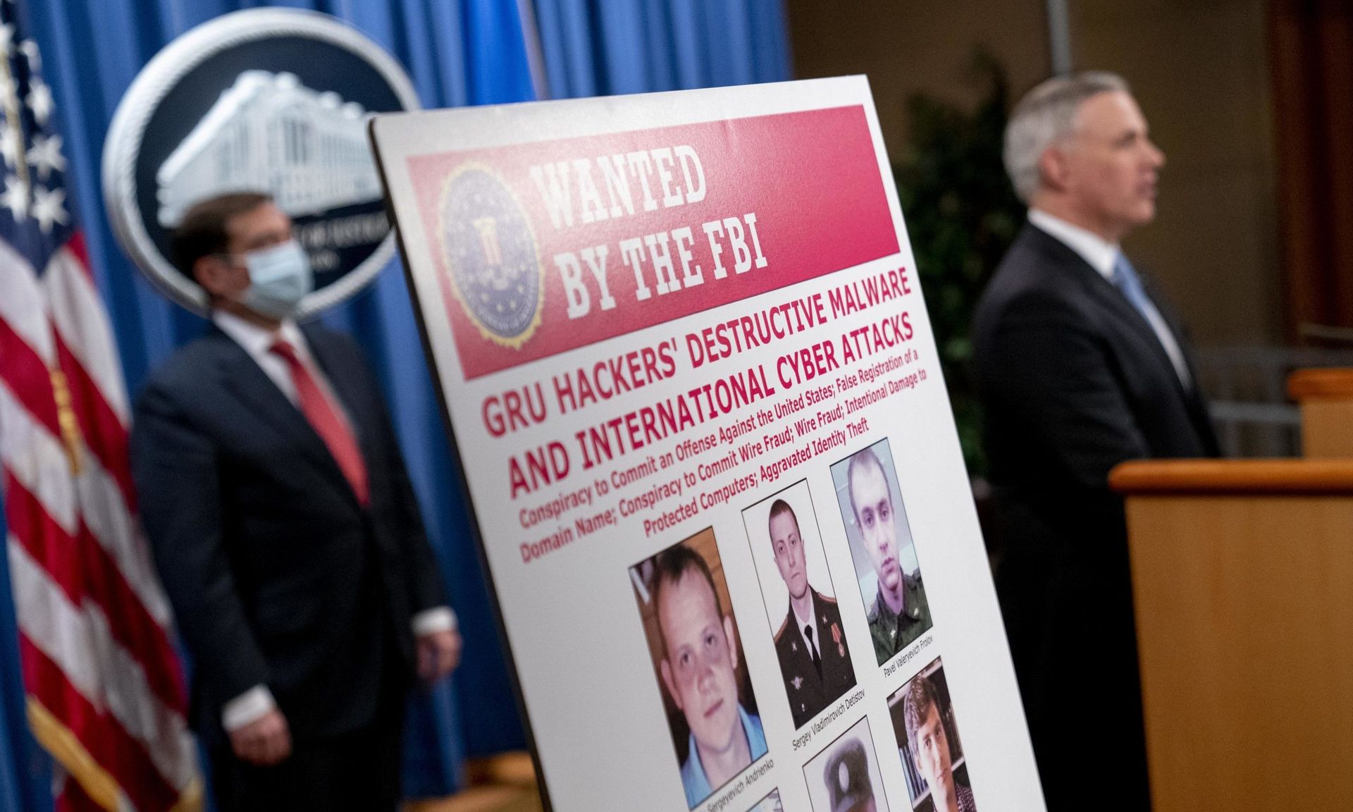 A poster showing six wanted Russian military intelligence officers is displayed at a news conference at the Department of Justice,  on October 19, 2020 in Washington, D.C. The Justice Department announced an indictment against six Russia GRU officers charged with engaging in a series of hacking and malware deployment operations. (Andrew Harnik R...