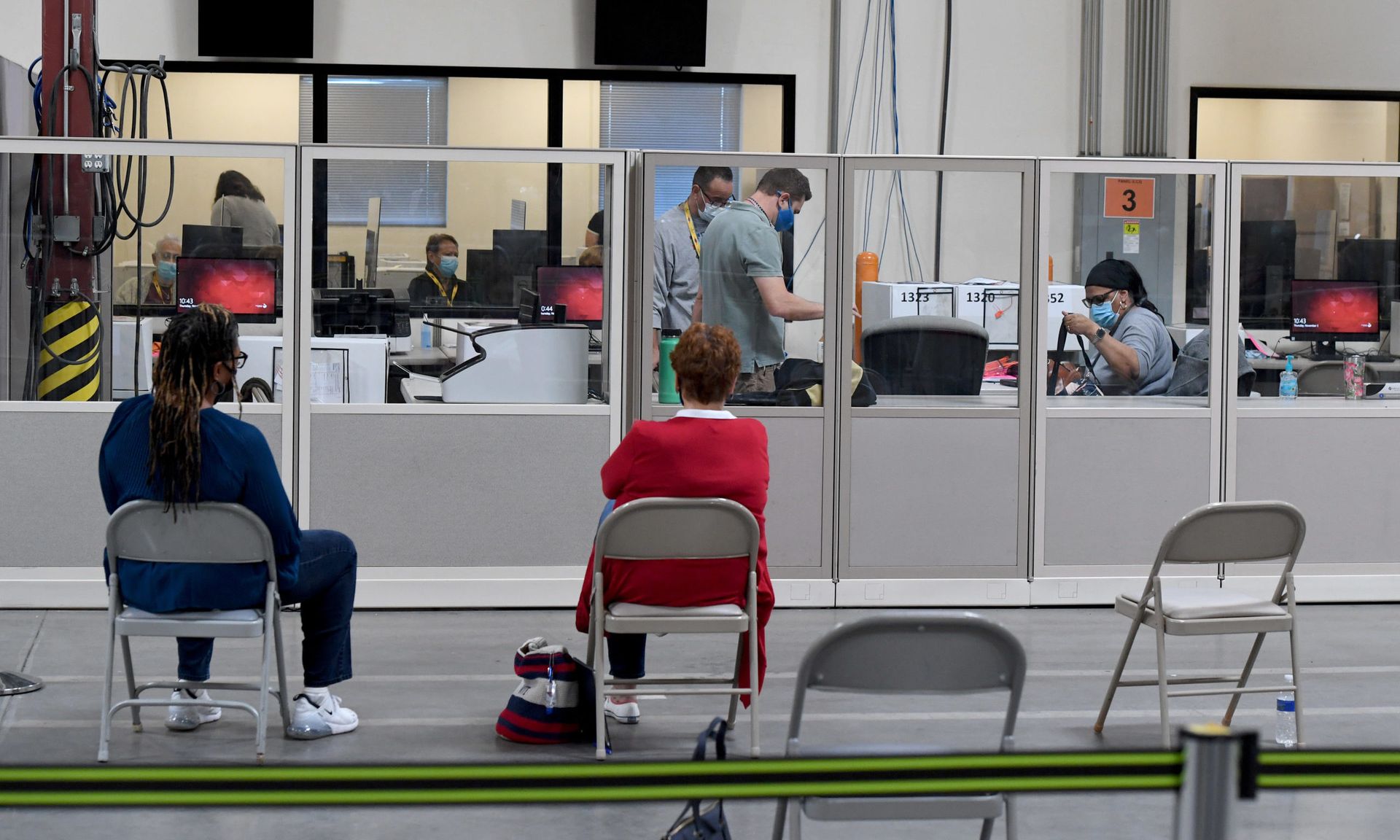 Observers look on as Clark County election workers count ballots at the Clark County Election Department on November 5, 2020 in North Las Vegas, Nevada.  (Photo by Ethan Miller/Getty Images)