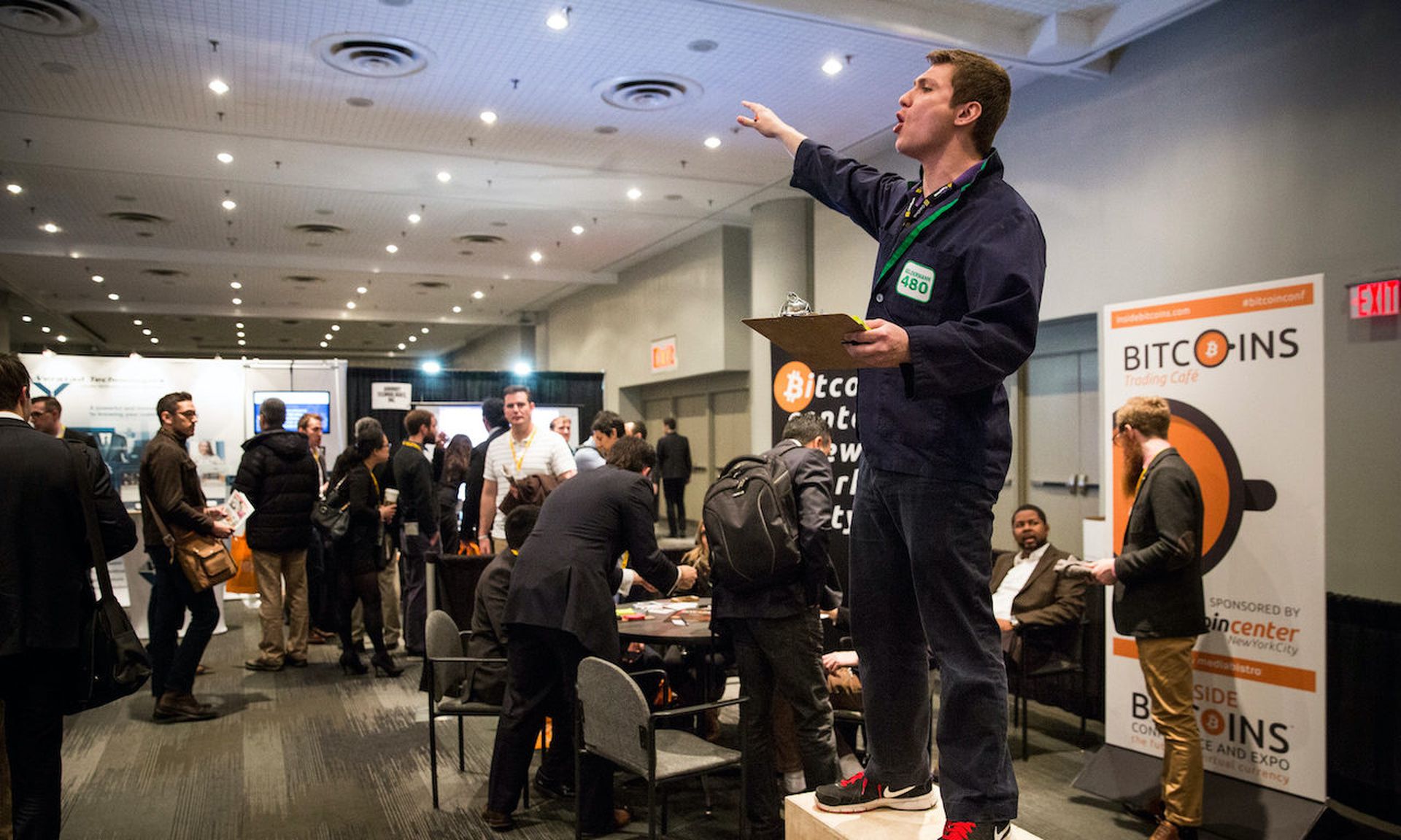 Tariqariq Albazzaz looks for people to trade bitcoins with him at a Bitcoin conference at the Javits Center  in New York City. Akropolis.io, a cryptocurrency loan and investment platform, offered hackers that stole the equivalent of $2 million from the service, $200,000 to return the money. (Andrew Burton/Getty Images)