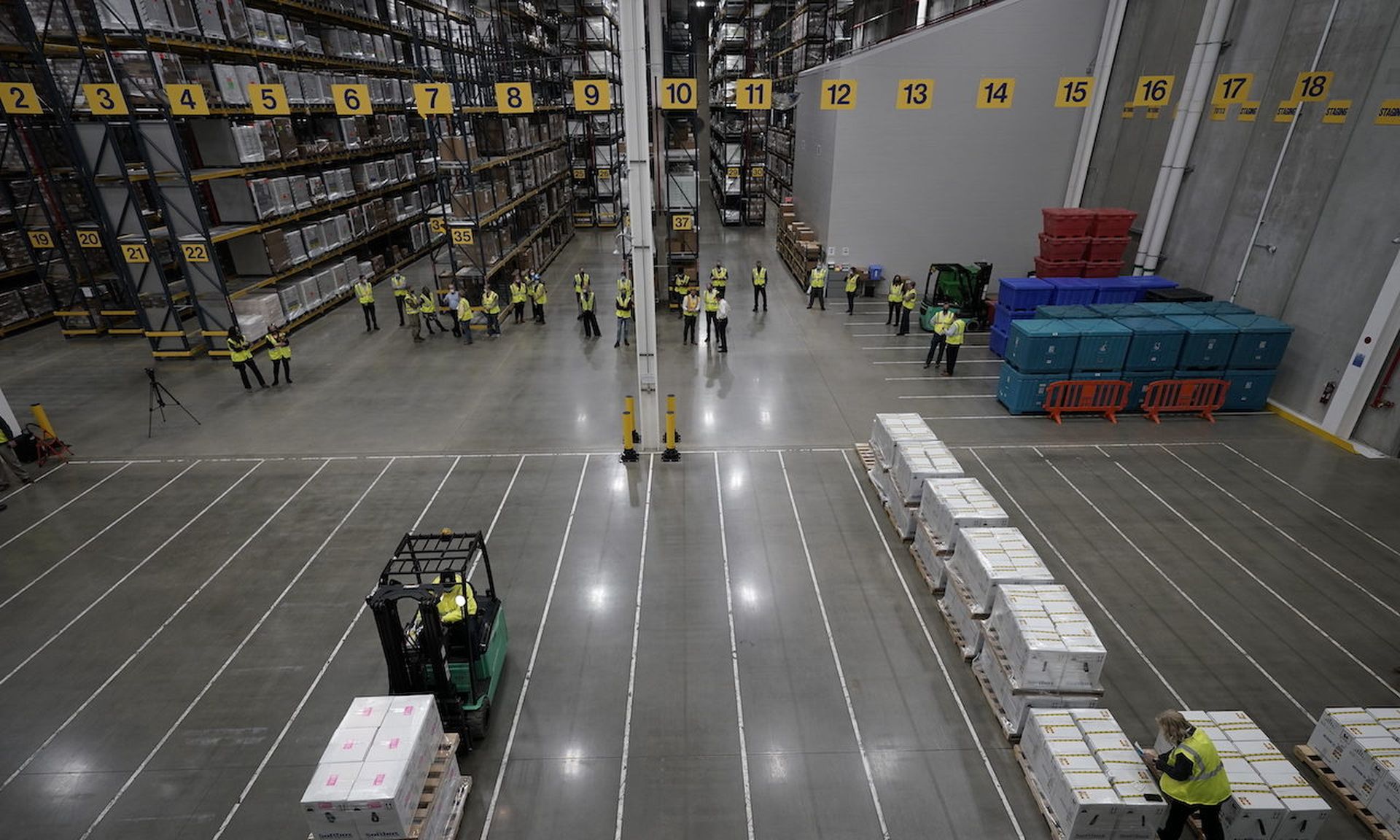 Boxes containing the Pfizer-BioNTech COVID-19 vaccine are prepared to be shipped at the Pfizer Global Supply Kalamazoo manufacturing plant. Along with gains in efficiency, increased automation trends are bringing new security risks to the manufacturing sector, CISA warned the public this week. (Photo by Morry Gash &#8211; Pool/Getty Images)