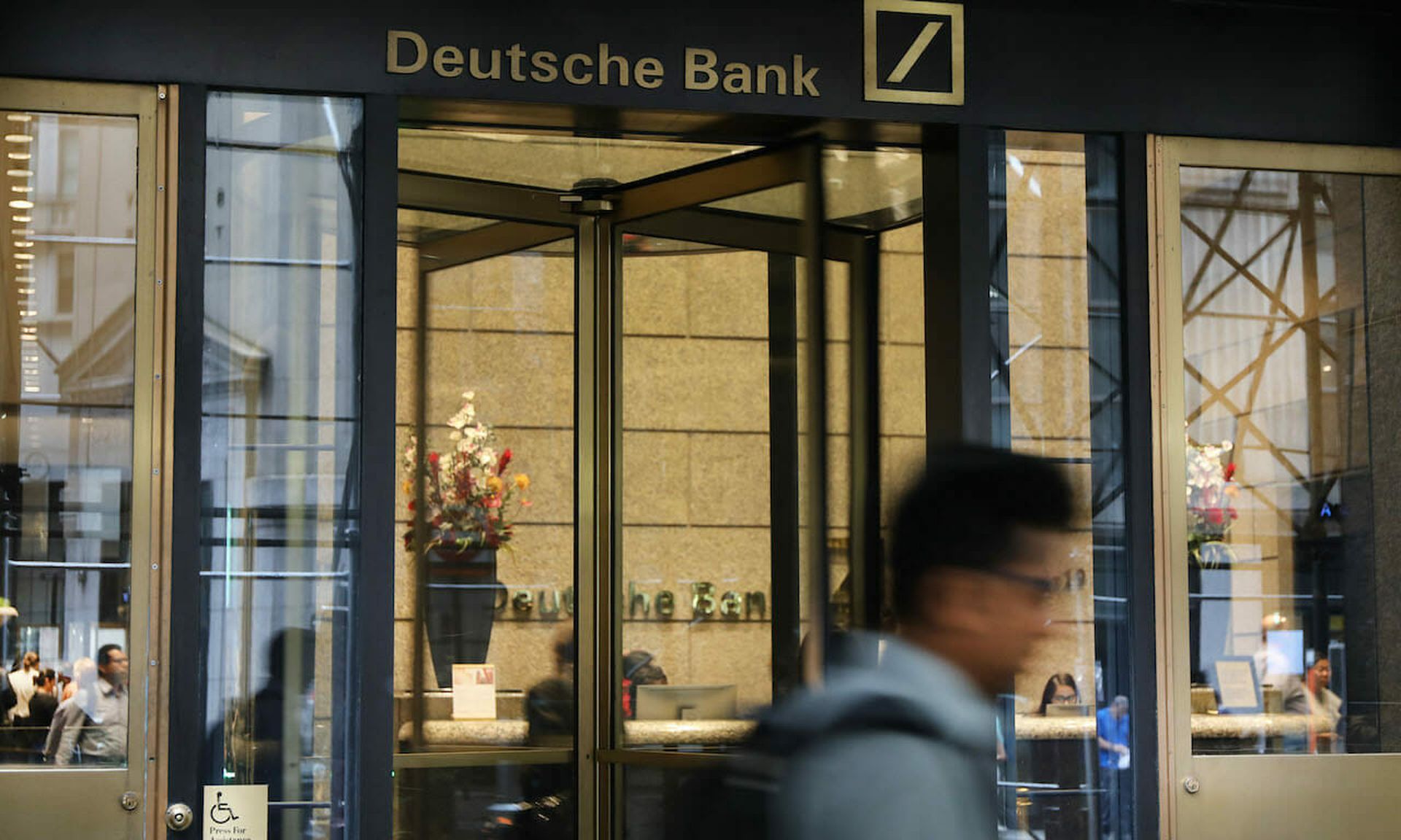 eople walk past Deutsche Bank&#8217;s Manhattan headquarters in New York City. (Photo by Spencer Platt/Getty Images)