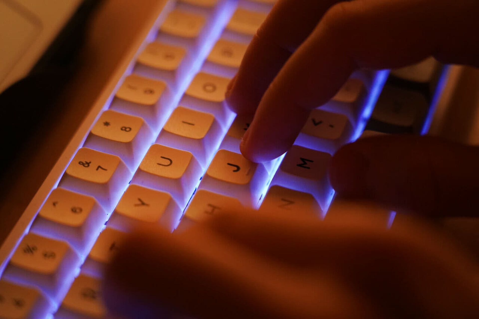 BERLIN, GERMANY &#8211; JANUARY 25: In this photo illustration a young man types on an illuminated computer keyboard typically favored by computer coders on January 25, 2021 in Berlin, Germany. 2020 saw a sharp rise in global cybercrime that was in part driven by the jump in online retailing that ensued during national lockdowns as governments soug...