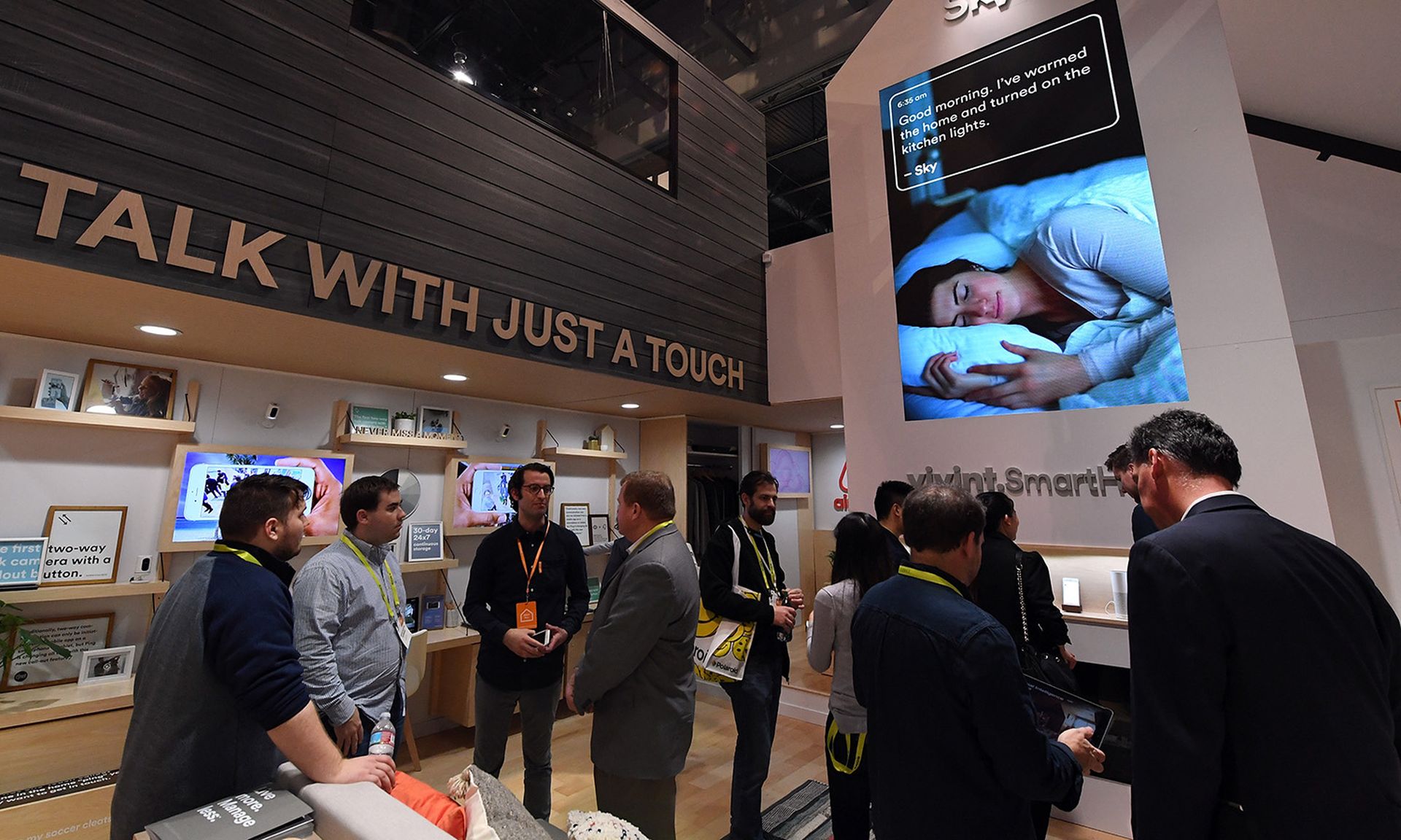 Attendees visit a booth near a display for smart home devices at the Sands Expo and Convention Center on Jan. 5, 2017, in Las Vegas. (Photo by Ethan Miller/Getty Images)