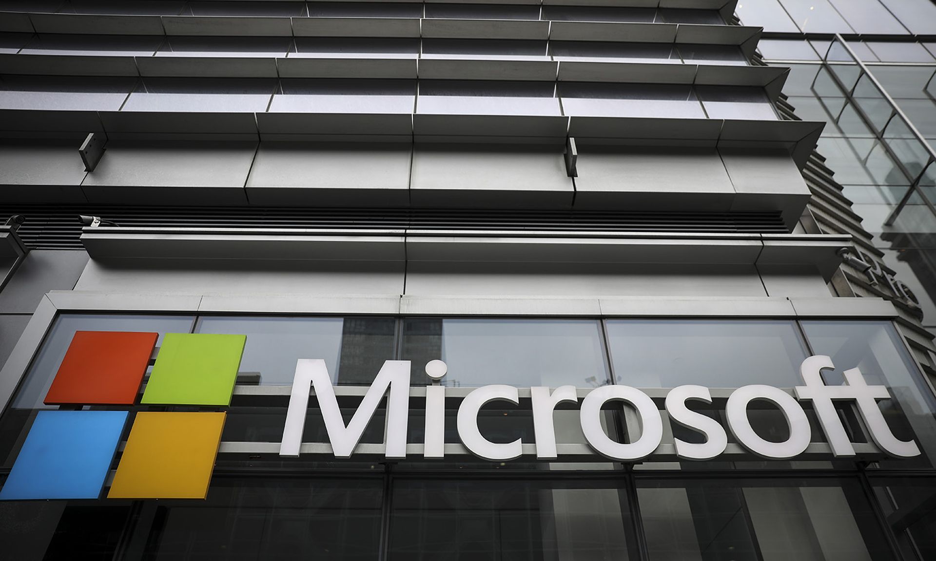 The Microsoft logo is displayed outside the Microsoft Technology Center near Times Square, June 4, 2018, in New York City. (Photo by Drew Angerer/Getty Images)