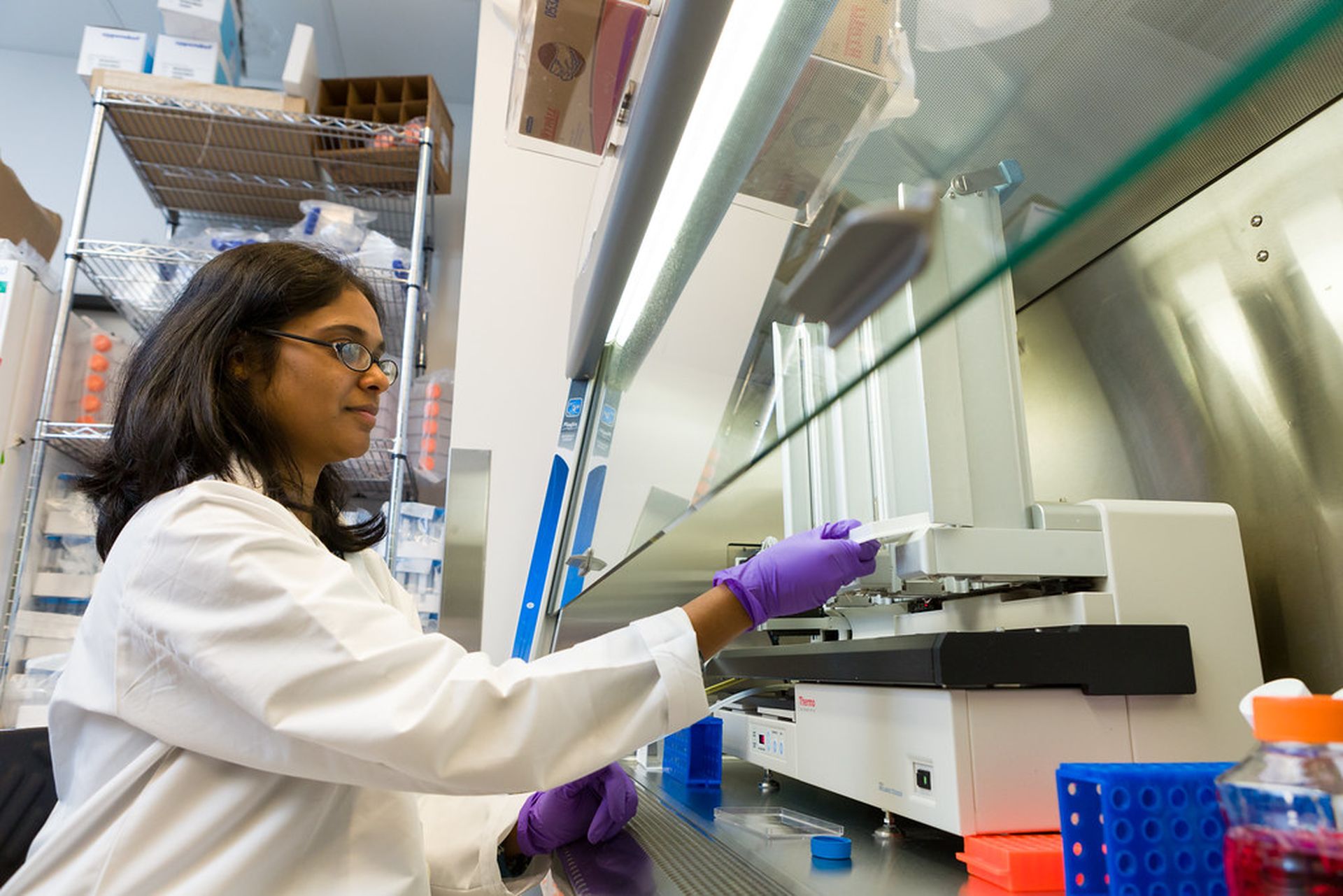 A researcher working with innovative genomics technology at the Trans-NIH RNAi Facility. Digital innovation has vastly improved research and care, but endpoint security is crucial for keeping data and tech secured. (Photo credit: &#8220;Working in the Trans-NIH RNAi Facility&#8221; by NIH-NCATS is marked with CC PDM 1.0)