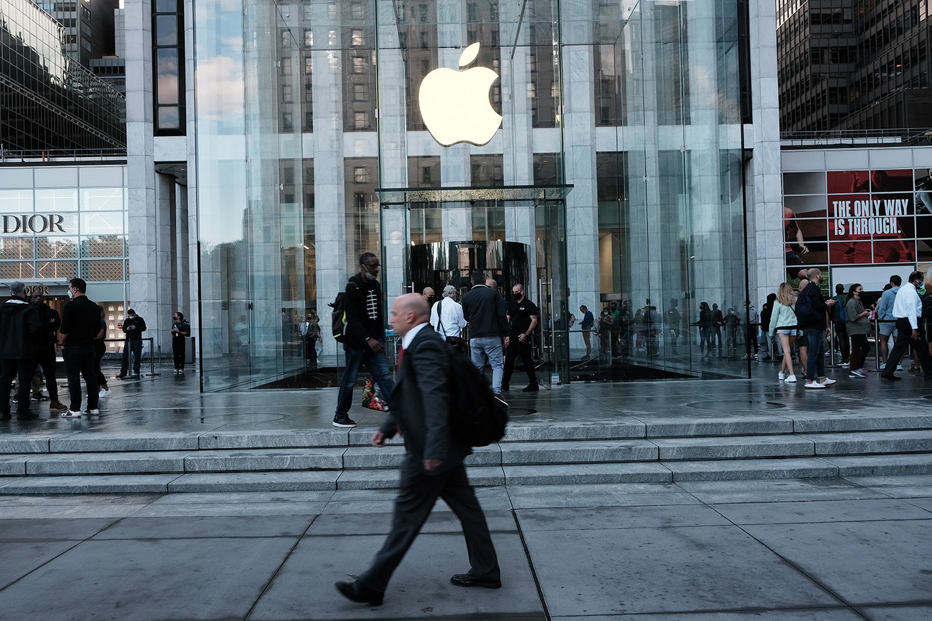 People shop at the Fifth Avenue Apple Store during the launch of Apple’s new iPhone 13 on Sept. 24, 2021, in New York City. Apple was introduced Tuesday as a new co-chair of the Cyber Readiness Institute. (Photo by Spencer Platt/Getty Images)