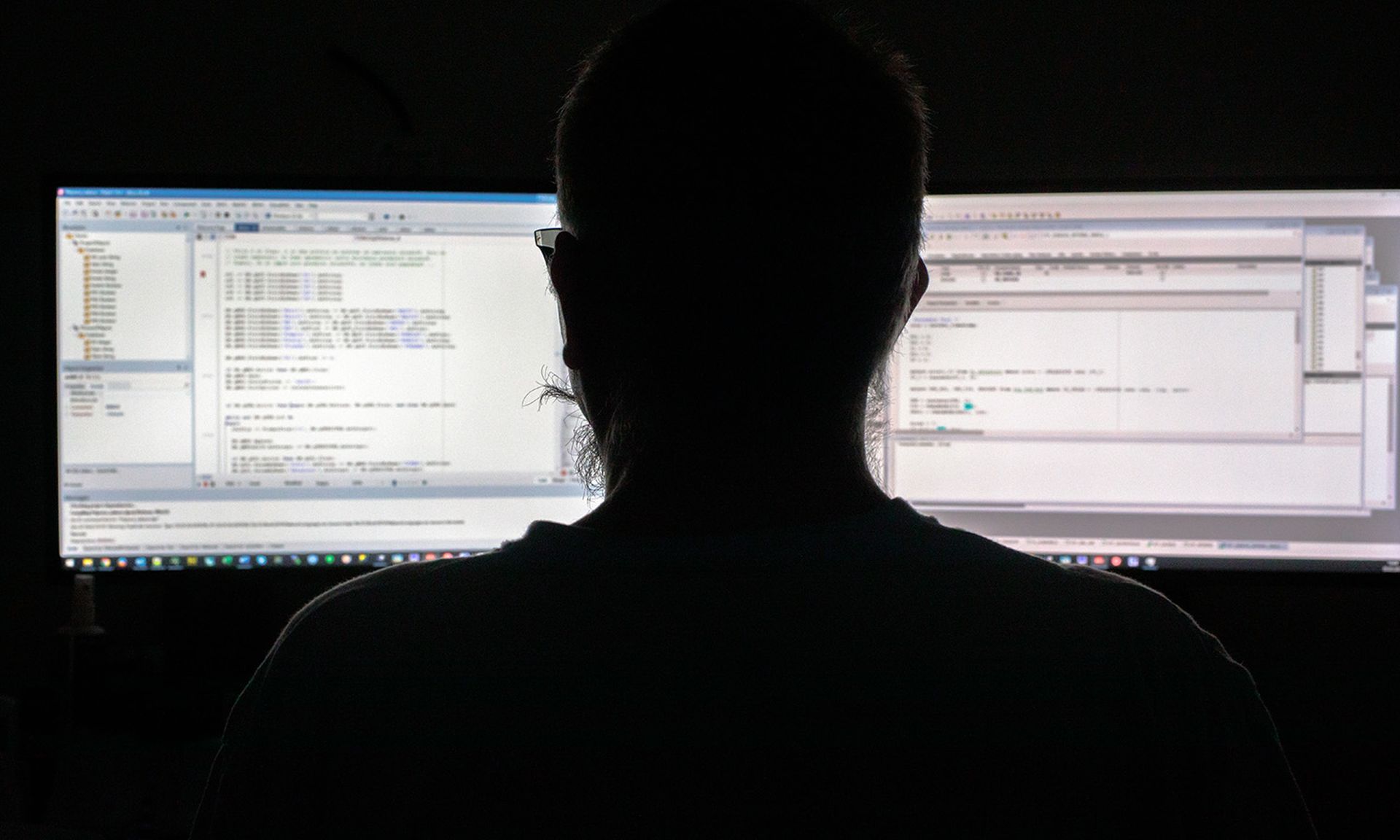 A programmer writes code and works on a computer on Feb. 5, 2021, in Putal, Slovenia. (Photo by Matic Zorman/Getty Images)