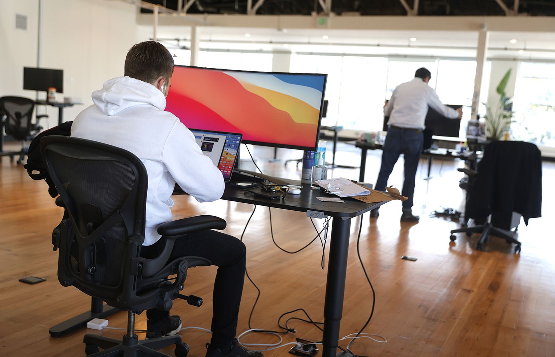 Vlad Lapich, with tech startup company Fast, works on his computer on the first day back in the office on March 24, 2021, in San Francisco. (Photo by Justin Sullivan/Getty Images)