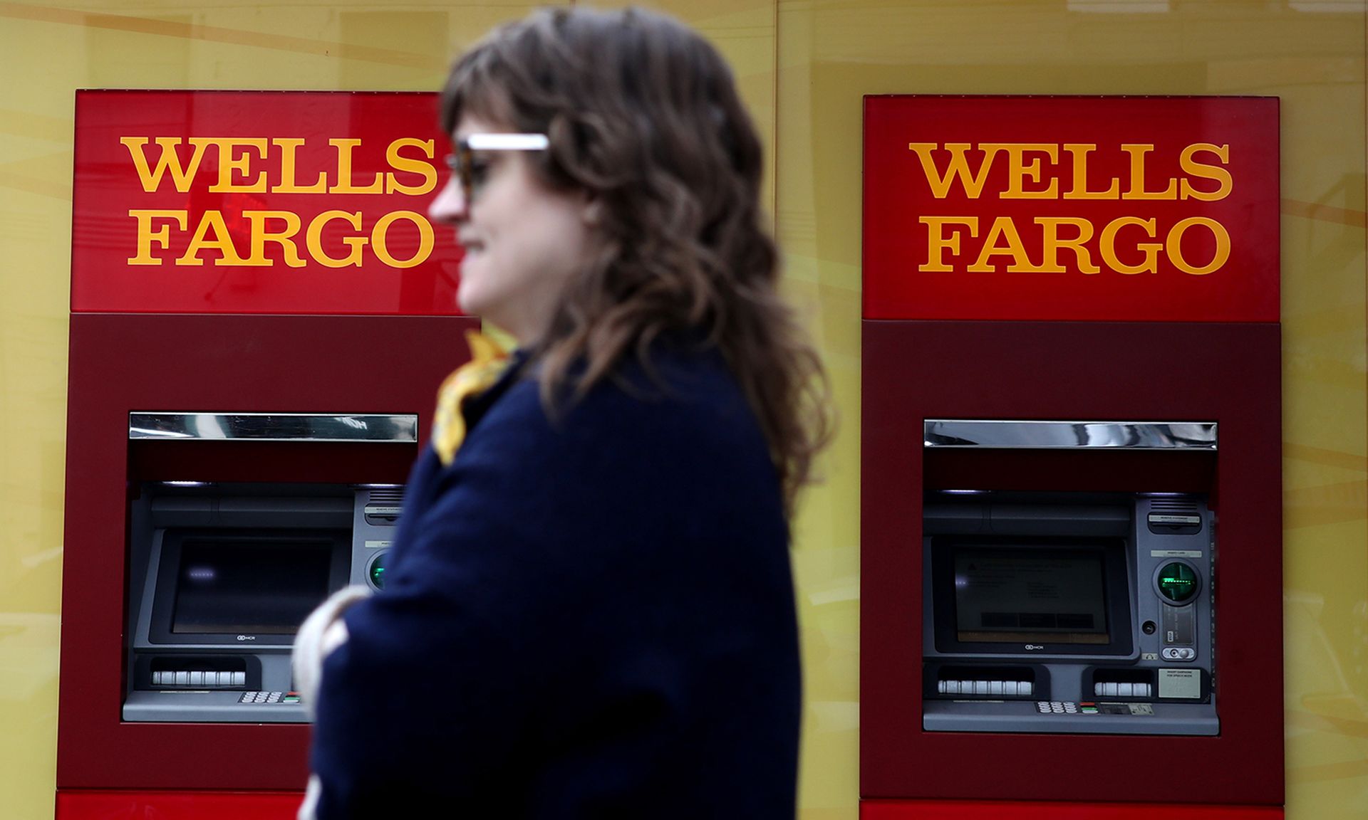 A pedestrian walks by a Wells Fargo Bank office on Feb. 07, 2019, in San Francisco. (Justin Sullivan/Getty Images)