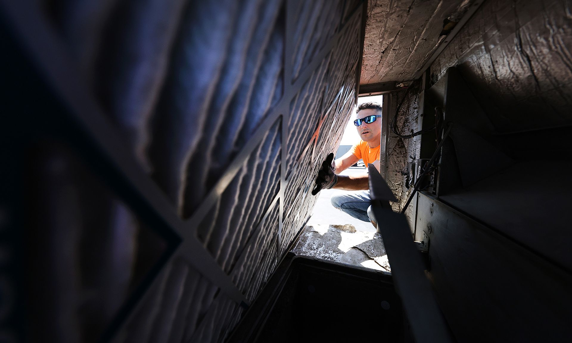 The riskiest healthcare devices included HVAC and electrical systems, according to a new Armis sruvey. Pictured: Mike Saladino installs a Merv 13 HVAC filter at Gold&#8217;s Gym Islip on Aug. 24, 2020, in Islip, New York. (Al Bello/Getty Images)