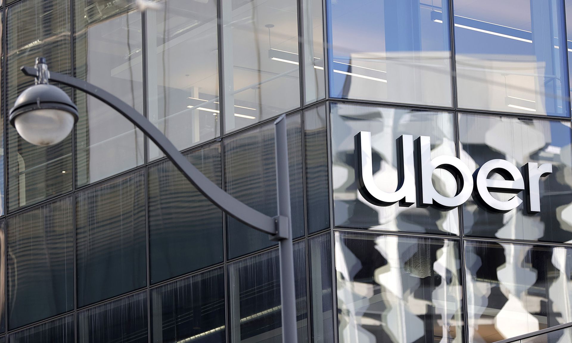 SAN FRANCISCO, CALIFORNIA &#8211; MARCH 29: A sign is posted on the exterior of the new Uber headquarters on March 29, 2021 in San Francisco, California. Uber is allowing some employees to return to work at their newly opened headquarters that was completed during the pandemic. San Francisco has entered the orange tier of reopening which allows non...