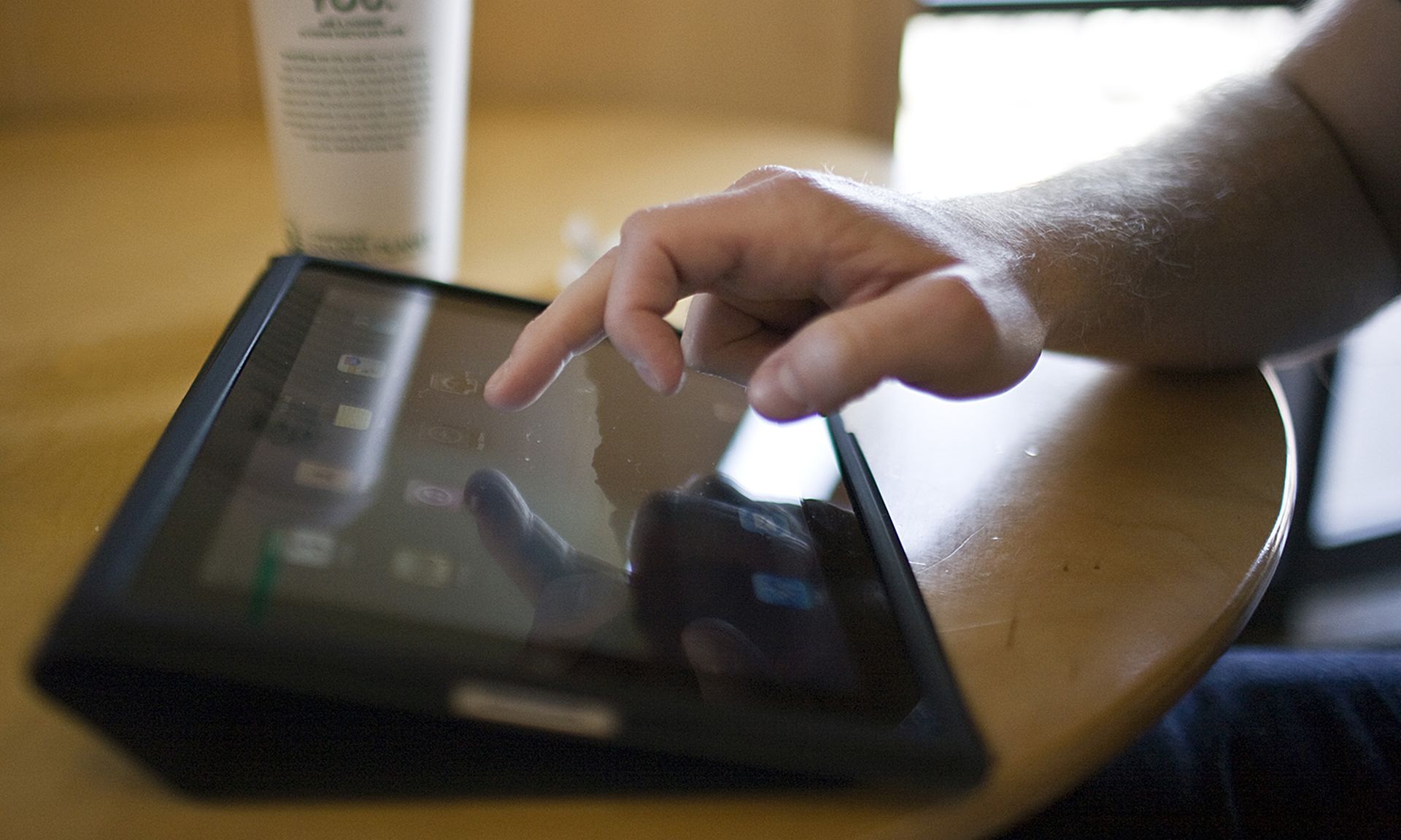 According to ObserveIT, more than half (55%) of enterprises report that their greatest internal risk comes from privileged users. Pictured: A man browses the internet on his newly purchased iPad device while visiting a Starbucks Coffee location April 3, 2010, in Fort Worth, Texas. (Photo by Tom Pennington/Getty Images)