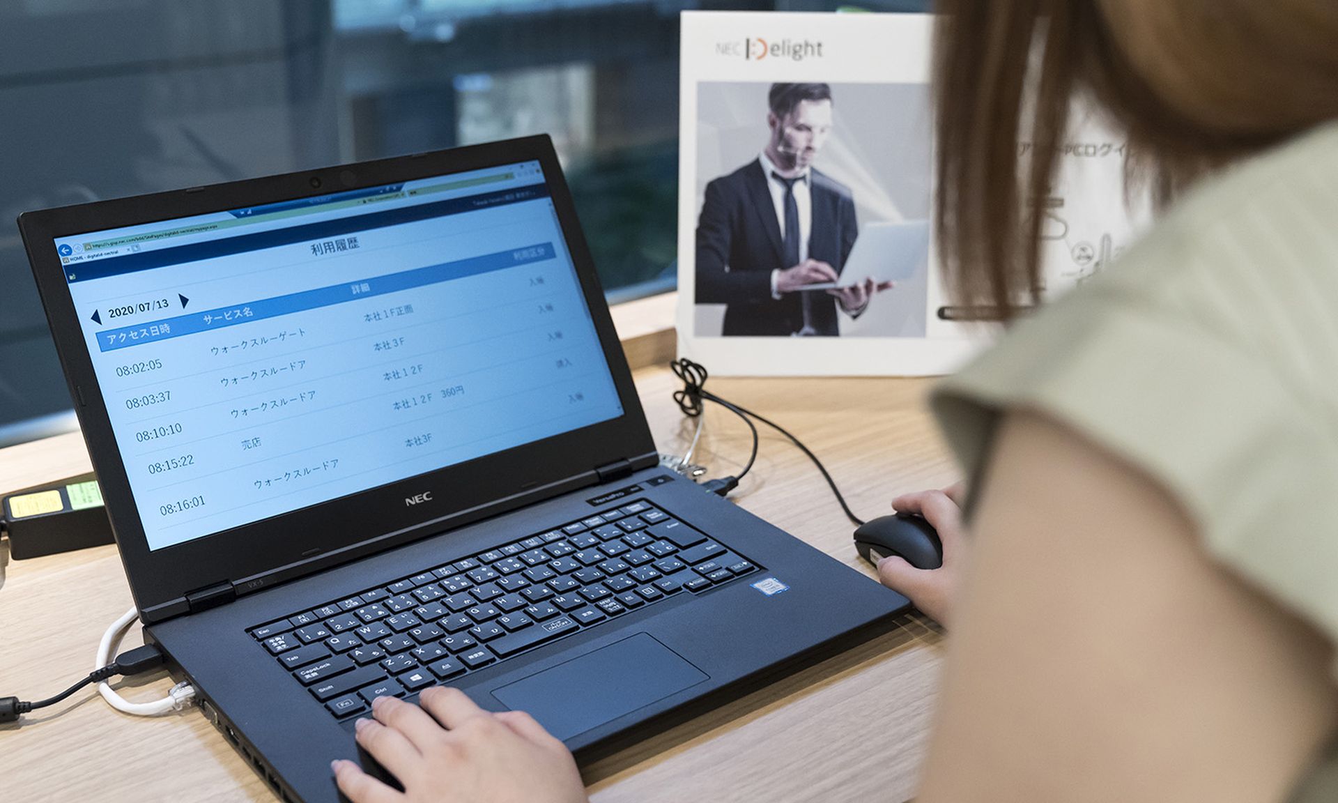 An employee uses a laptop computer during a demonstration of the shared PC with face-recognition technology, eliminating the need to input a password at the NEC Corporation headquarters on July 13, 2020, in Tokyo. (Photo by Tomohiro Ohsumi/Getty Images for NEC Corporation)