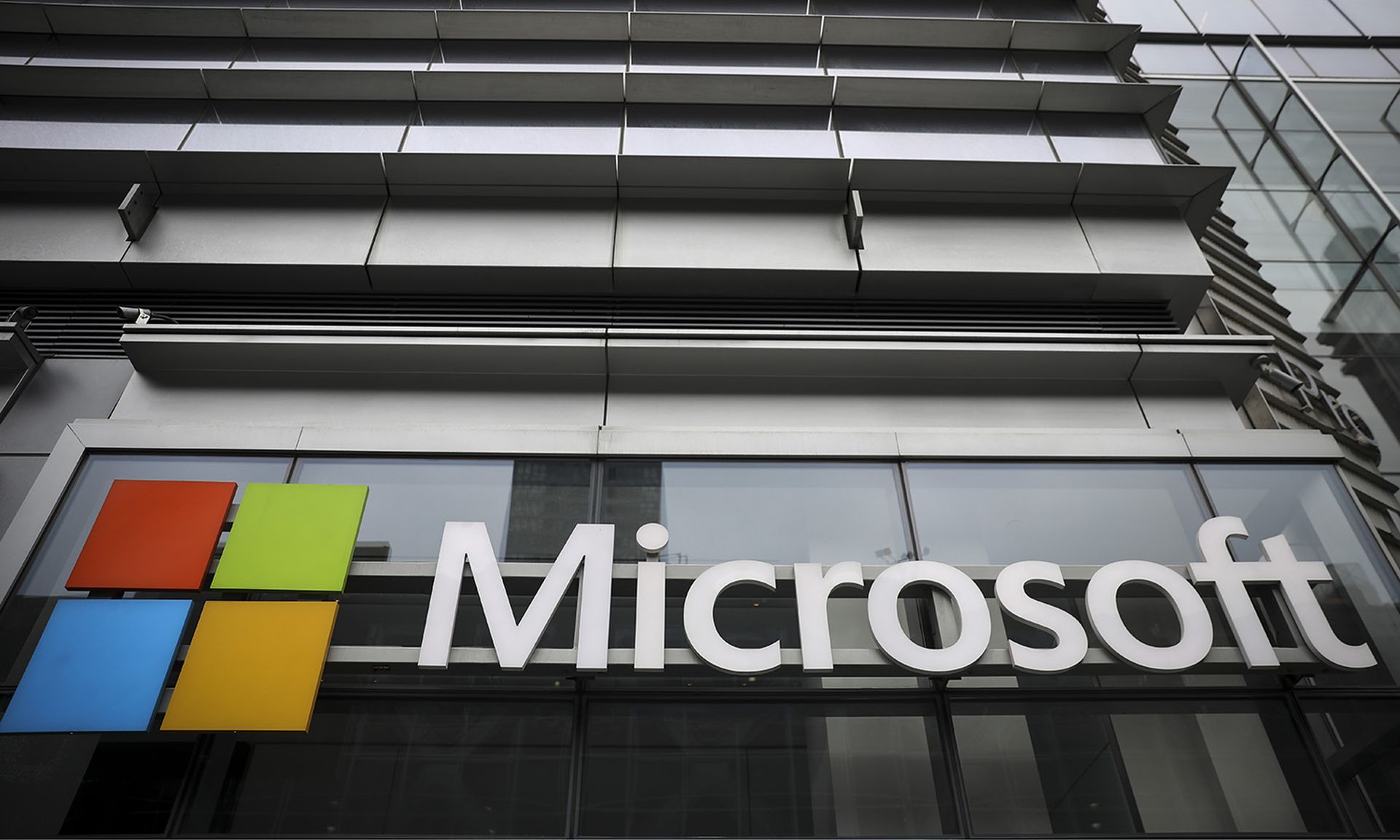 The Microsoft logo is displayed outside the Microsoft Technology Center near Times Square, June 4, 2018, in New York City. (Photo by Drew Angerer/Getty Images)