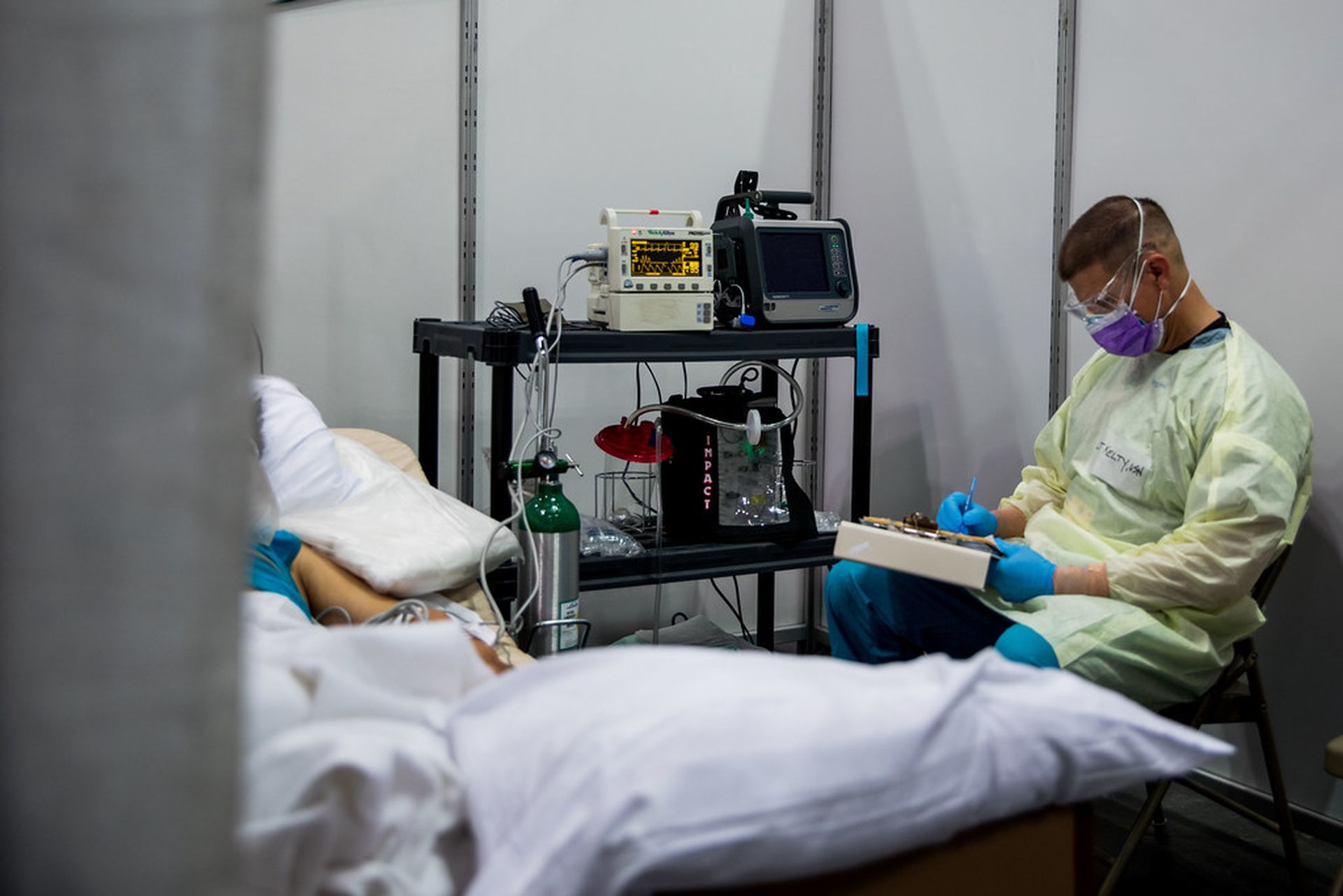 New HHS guidance takes aim at the healthcare sector&#8217;s struggles to identify and remediate the risk of insiders. (Photo credit: &#8220;Lt. James Kelty monitors a critically-ill COVID-19 patient in the intensive care unit at Javits New York Medical Station, April 13, 2020.&#8221; by Official U.S. Navy Imagery is marked with CC BY 2.0.)