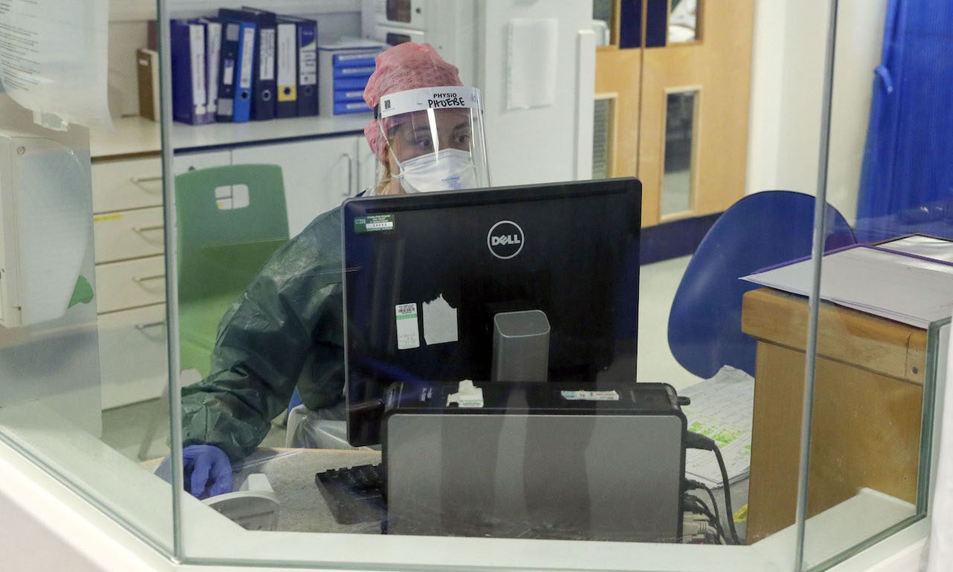 A physiotherapist sits at a workstation in an intensive care  (Photo by Steve Parsons &#8211; Pool/Getty Images)