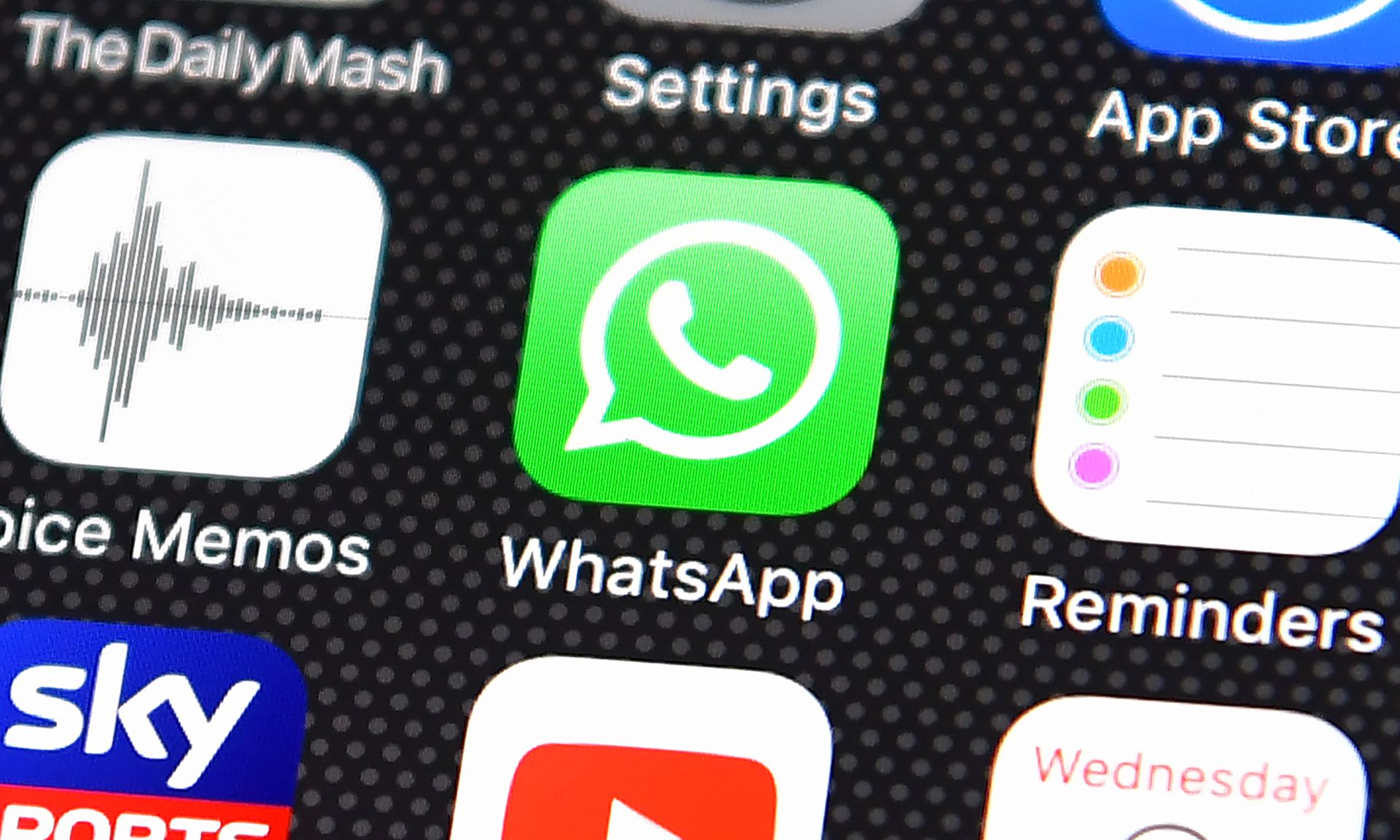 The Whatsapp app logo is displayed on an iPhone on Aug. 3, 2016, in London. (Photo by Carl Court/Getty Images)