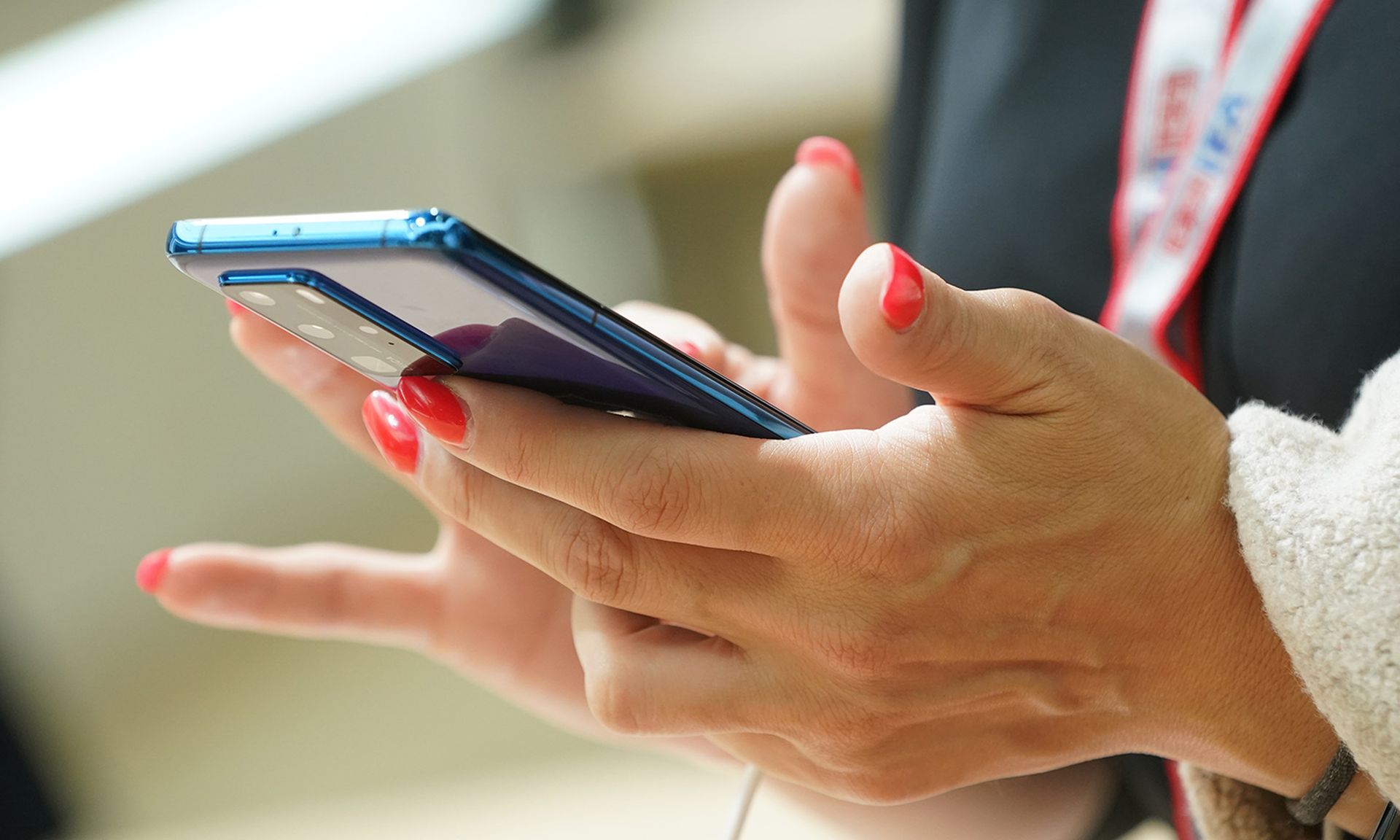 A visitor tries out a smartphone at the IFA 2020 Special Edition consumer electronics and appliances trade fair on Sept. 3, 2020, in Berlin. (Photo by Sean Gallup/Getty Images)