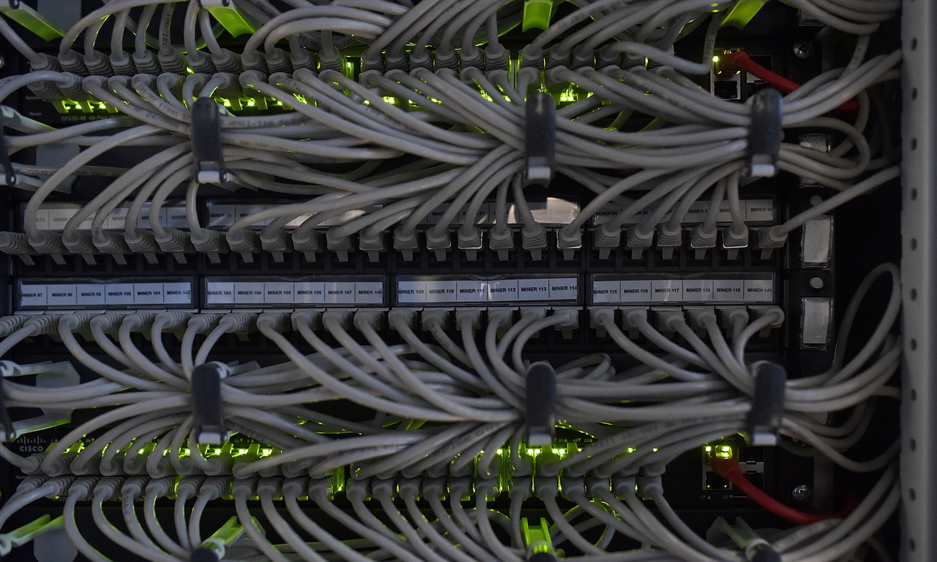 A technical system engineer and hardware asset manager performs control-and-maintenance operations of a cryptomining farm installed inside a hydroelectric power plant on Feb. 2, 2022, in Bolzano, Italy. (Photo by Alessio Coser/Getty Images)