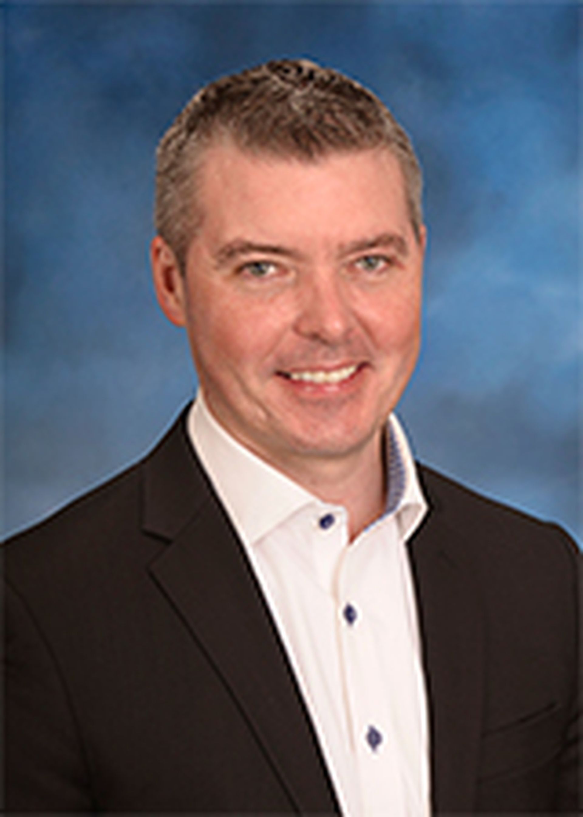 Jason Witty, eid 2N743, USAA employee, formal portrait, on blue, EA