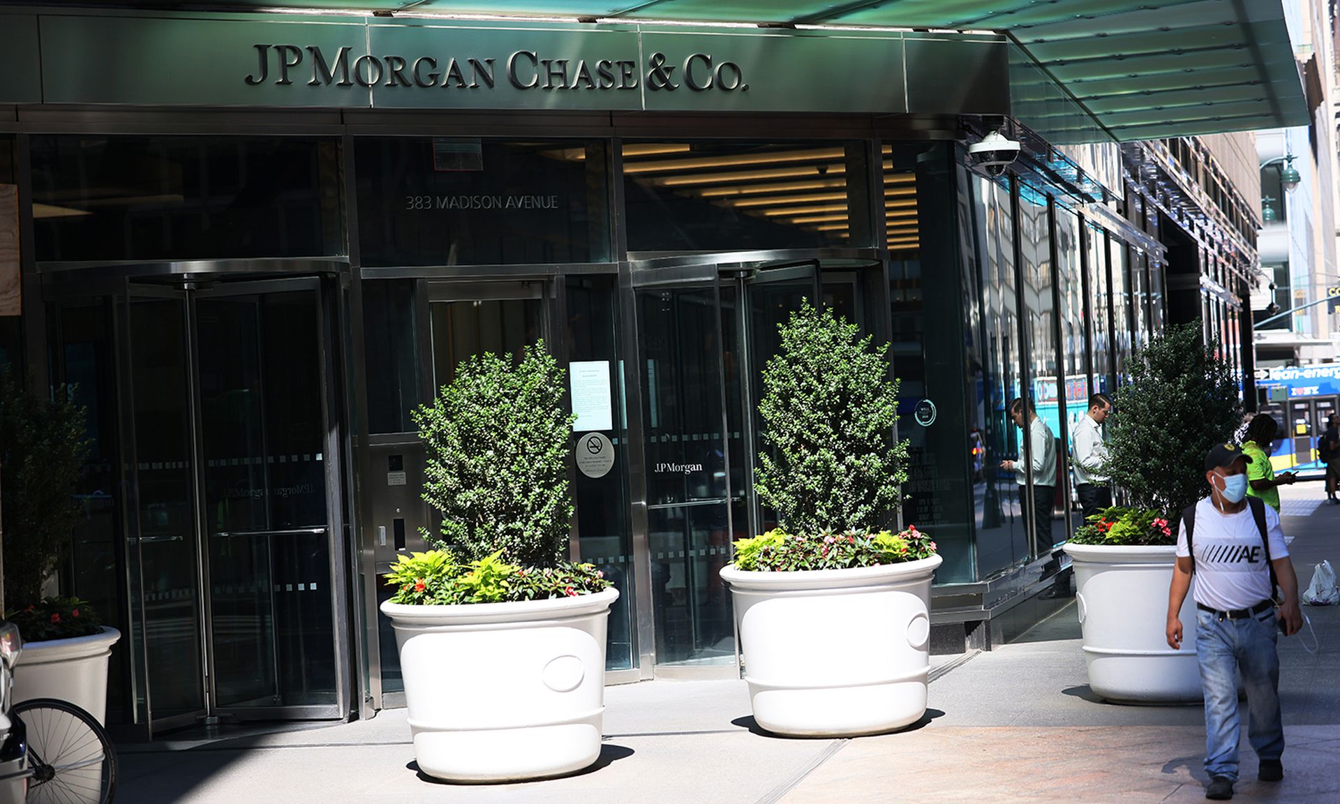 A person walks past the JP Morgan Chase headquarters building on Madison Avenue on July 14, 2022, in New York City. (Photo by Michael M. Santiago/Getty Images)