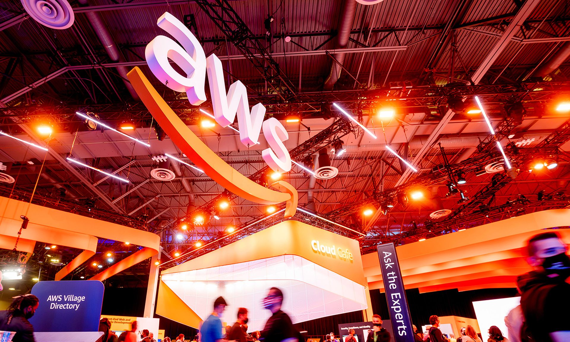 Attendees walk through an expo hall during AWS re:Invent 2021, a conference hosted by Amazon Web Services, at The Venetian Las Vegas on Nov. 30, 2021, in Las Vegas. (Photo by Noah Berger/Getty Images for Amazon Web Services)