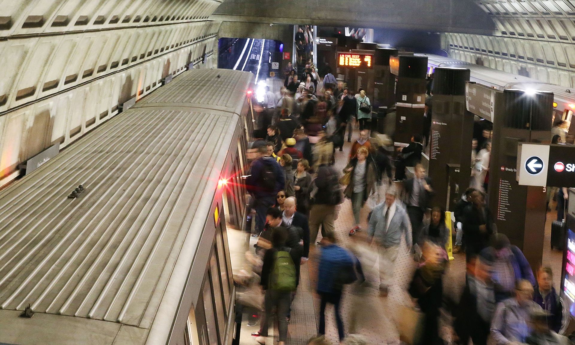 Commuters board a Metrorail train at Union Station in Washington.