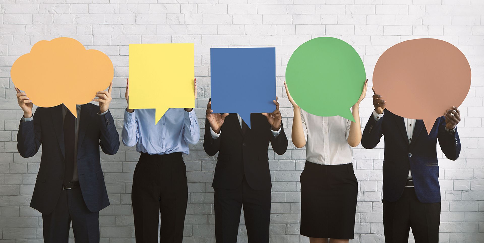 Group of corporate people hiding faces behind speech bubbles