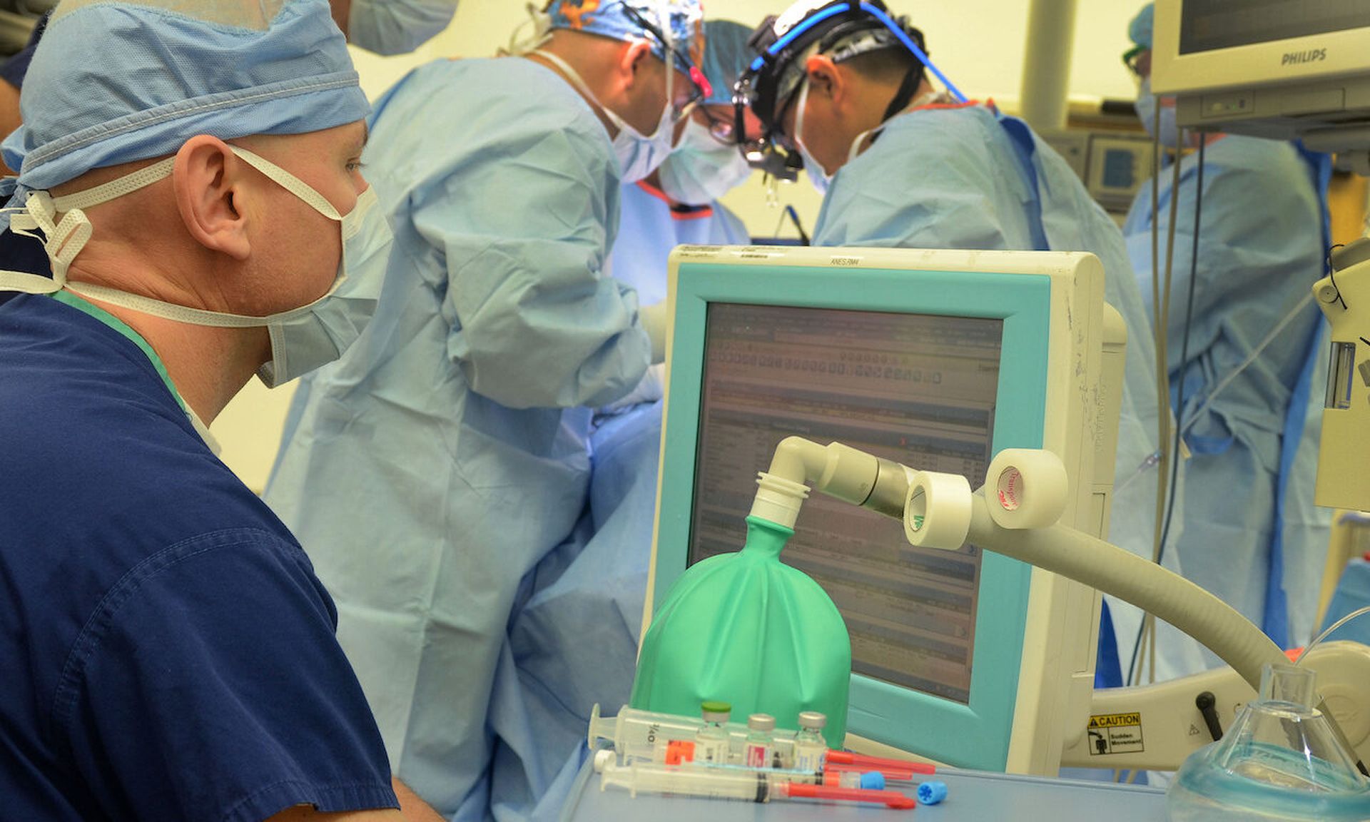 Cmdr. Jon Giacoman (l), an anesthesiologist at Naval Hospital Jacksonville, administers anesthesia to a patient. (U.S. Navy photo by Jacob Sippel, Naval Hospital Jacksonville Public Affairs/Released)