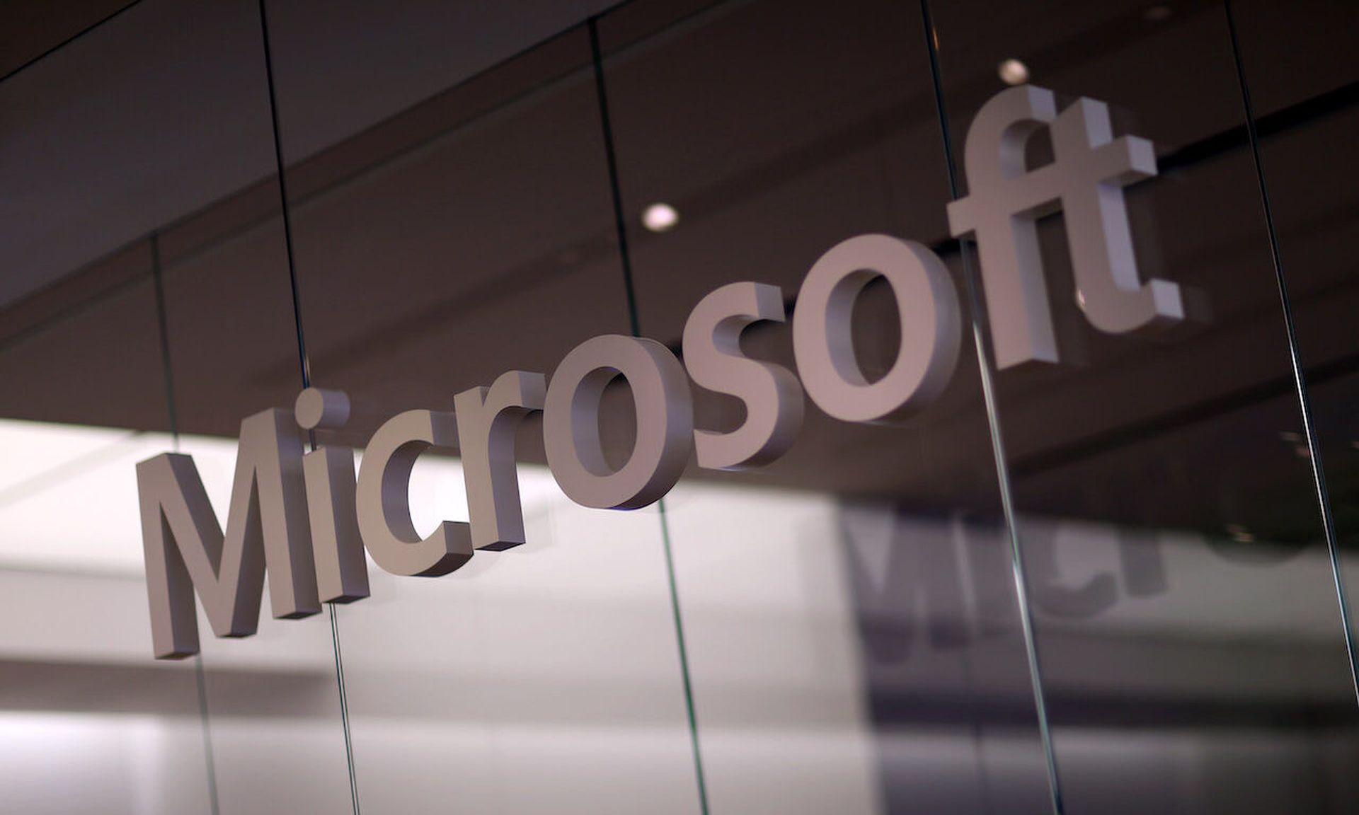 A Microsoft sign is seen as the new Windows 8.1 operating system is released at a Microsoft store in the Dadeland Mall October 17, 2013 in Miami, Florida.  The update was released a year after Windows 8 was released and includes fixes to some of the problems people experienced with the initial release.  (Photo by Joe Raedle/Getty Images)