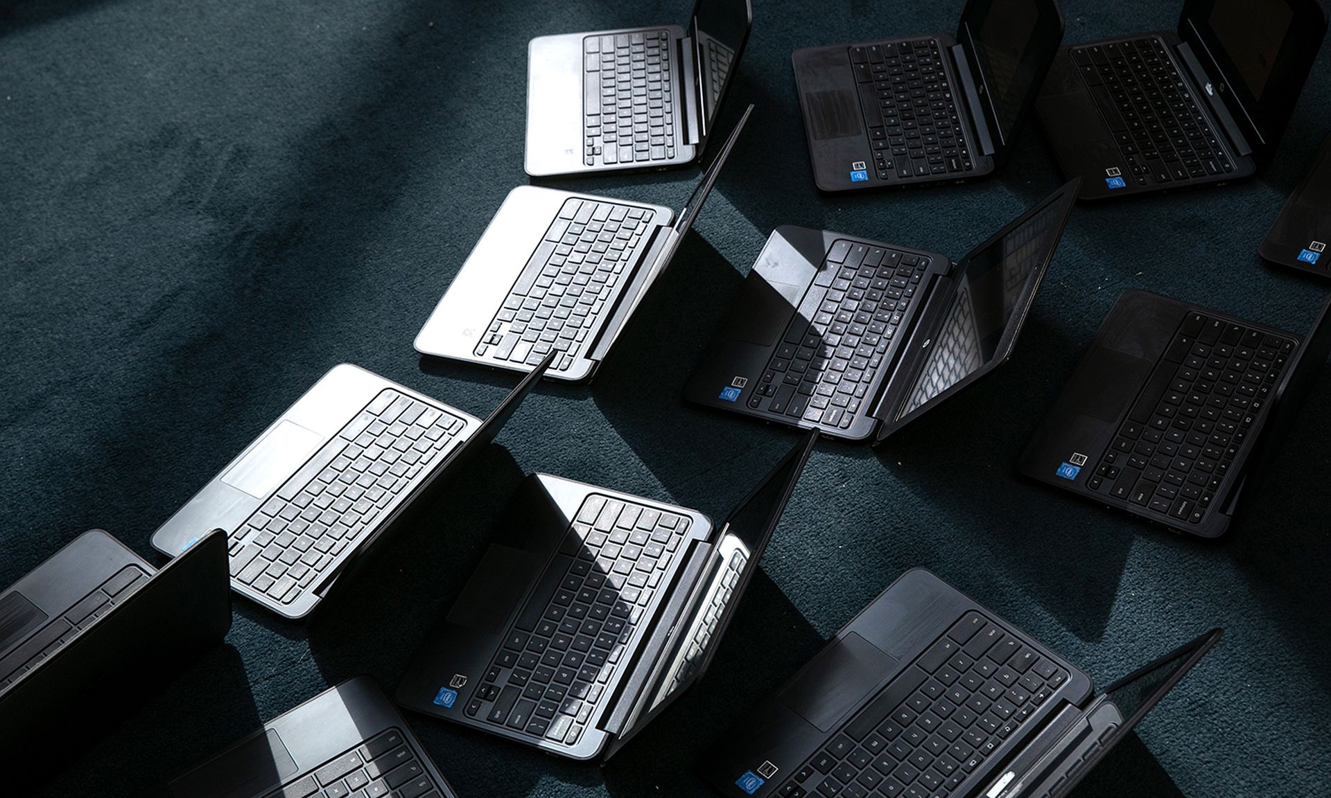 Chromebooks sitting on the ground