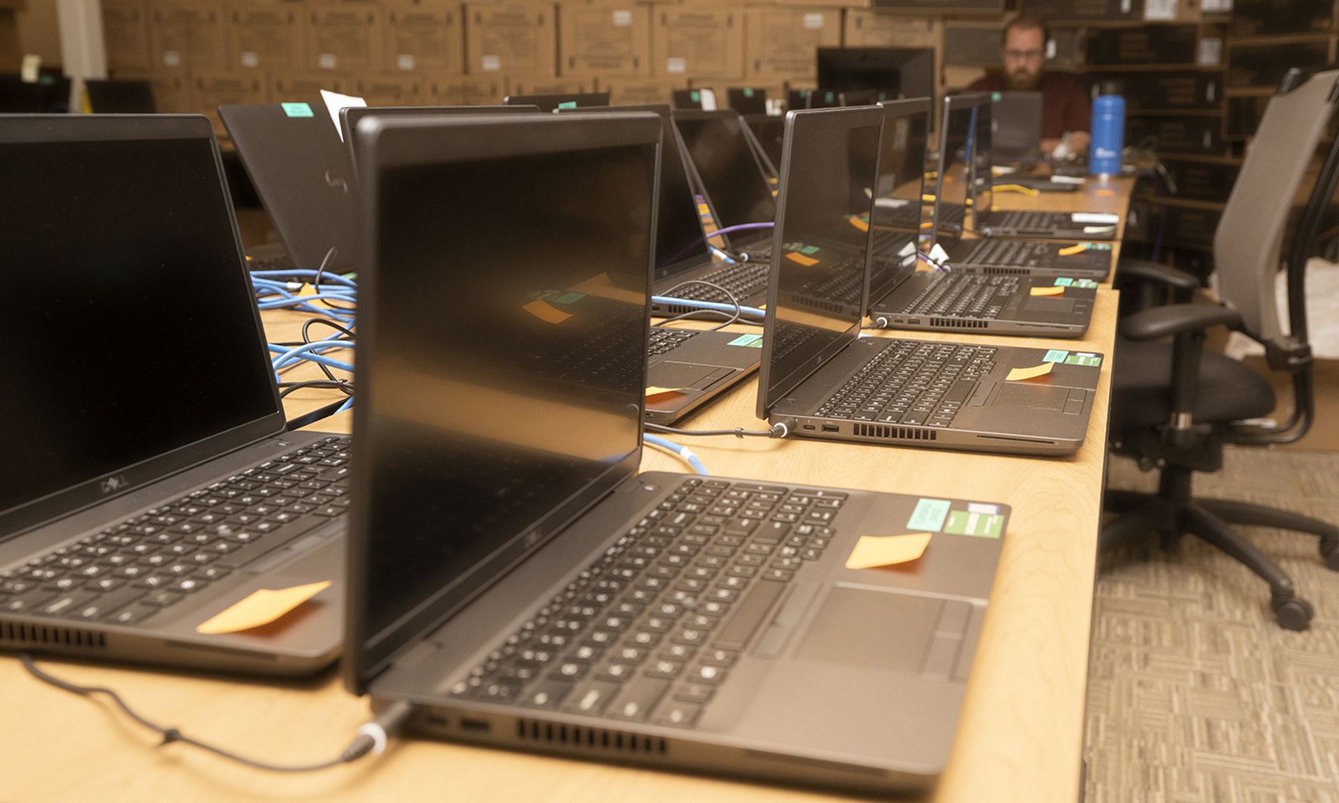 Laptops fill a table as part of a U.S. Transportation Command telework initiative at Scott Air Force Base, Illinois, April 15, 2020. USTRANSCOM&#8217;s Control, Communications and Cyber Systems Directorate were adding software and imaging laptops to issue to command members for official telework use to continue global mission operations while prote...