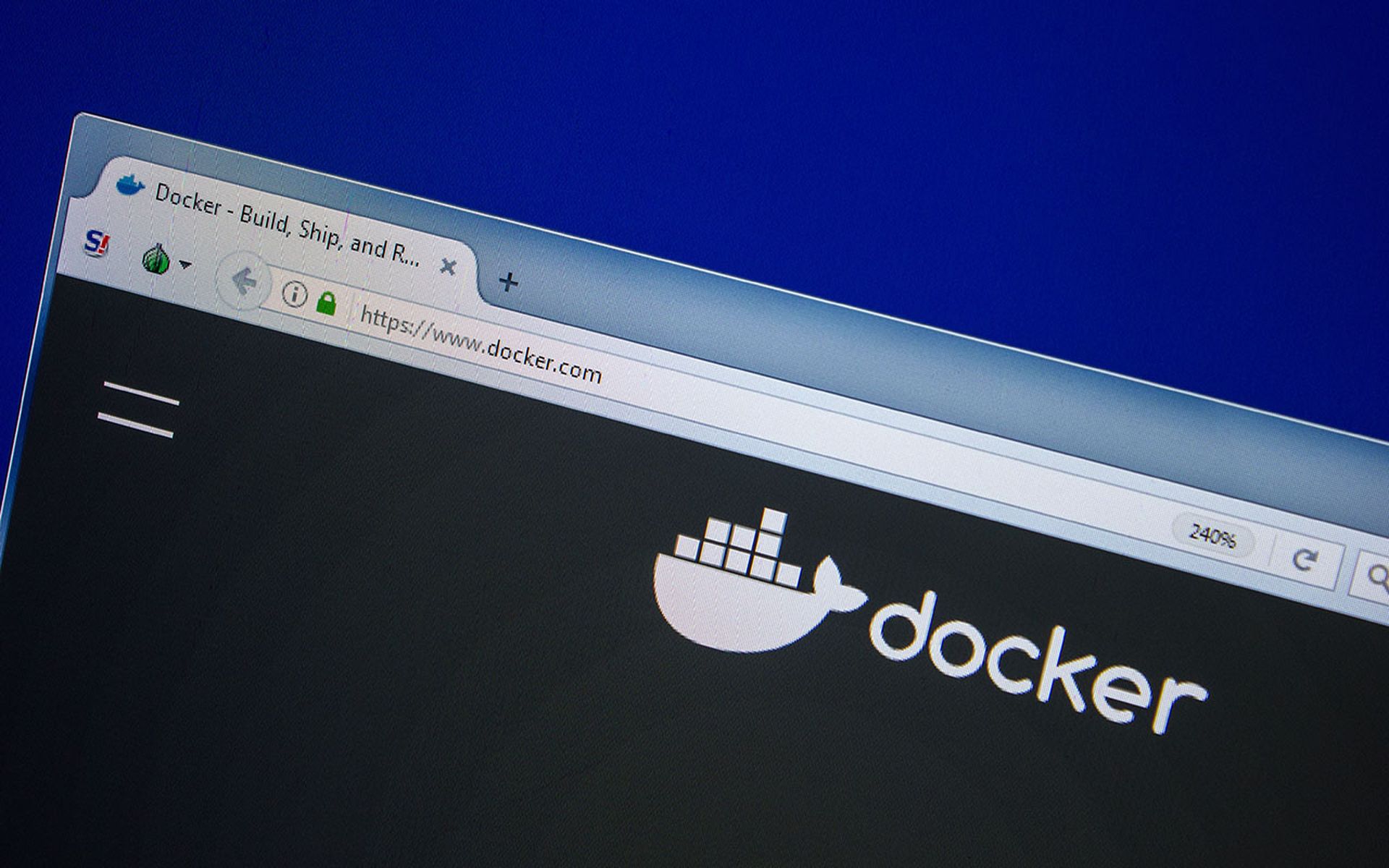 The Docker website is displayed on a computer.