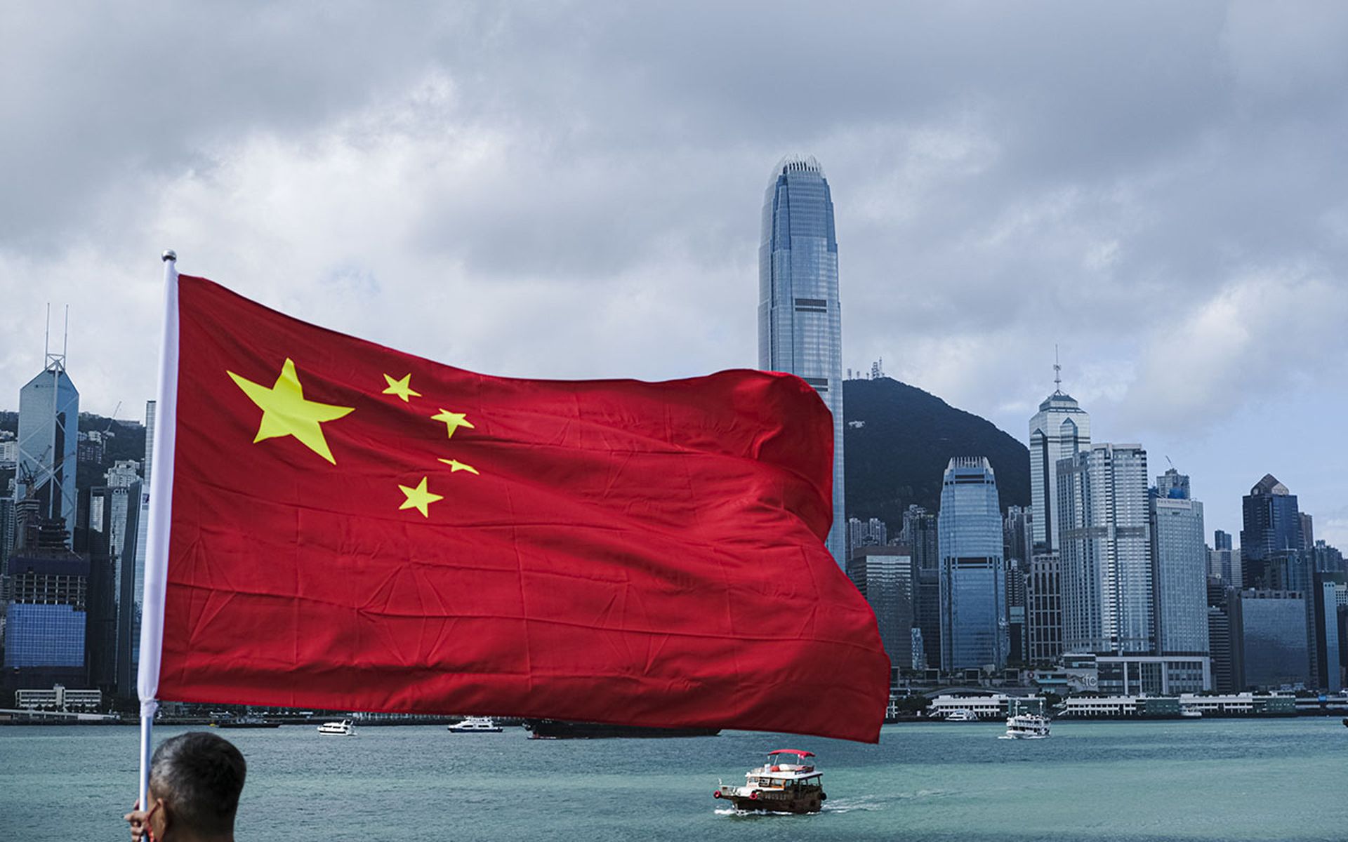 A man waves a Chinese flag