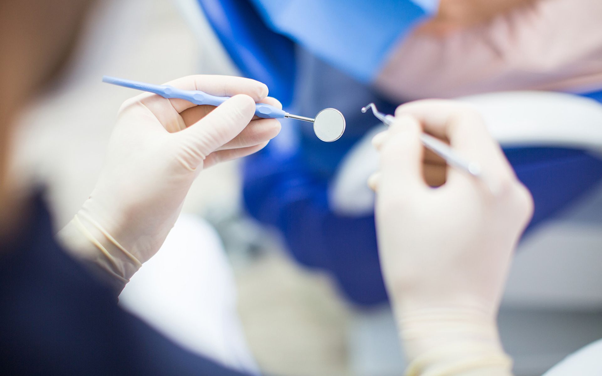 Dentist at work with tools