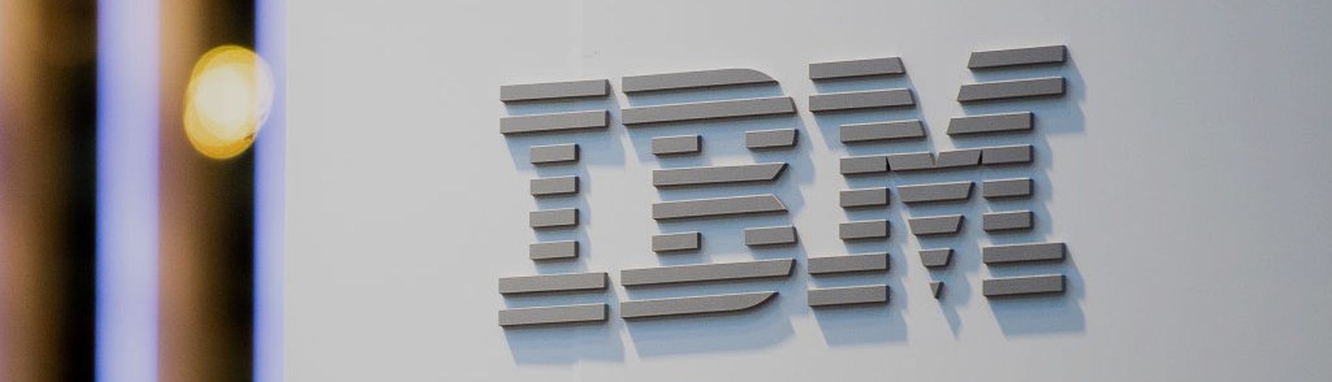 BARCELONA, SPAIN &#8211; FEBRUARY 26:  A logo sits illumintated outside the IBM booth on day 2 of the GSMA Mobile World Congress 2019 on February 26, 2019 in Barcelona, Spain. The annual Mobile World Congress hosts some of the world&#8217;s largest communications companies, with many unveiling their latest phones and wearables gadgets like foldable...