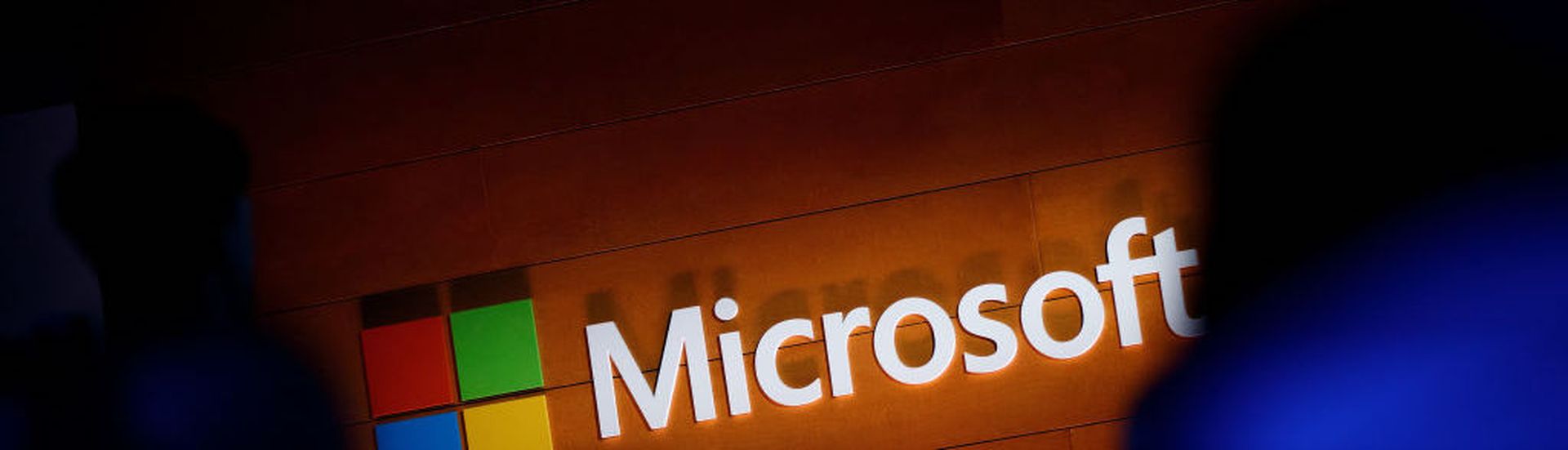 NEW YORK, NY &#8211; MAY 2: The Microsoft logo is illuminated on a wall during a Microsoft launch event to introduce the new Microsoft Surface laptop and Windows 10 S operating system, May 2, 2017 in New York City. The Windows 10 S operating system is geared toward the education market and is Microsoft&#8217;s answer to Google&#8217;s Chrome OS. (P...