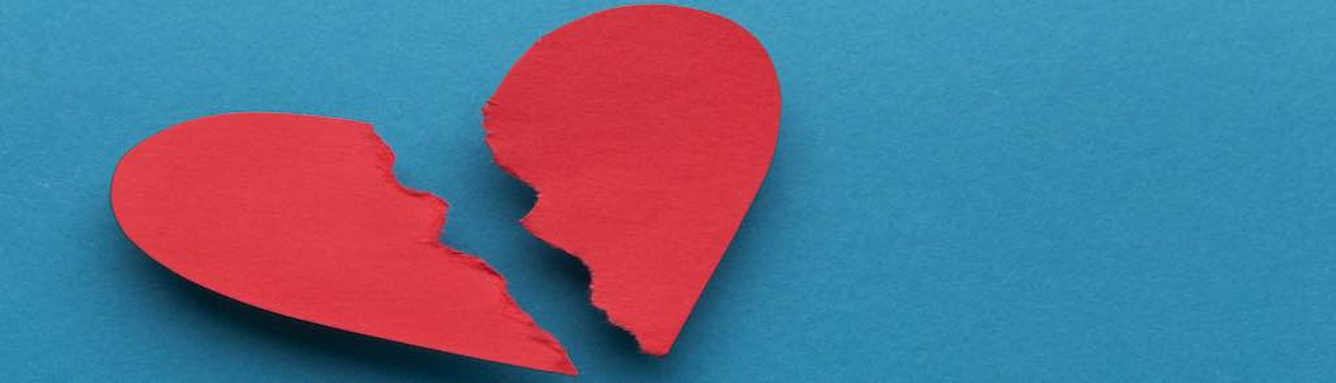 Sign of divorce. Broken paper heart on blue background, top view, copy space