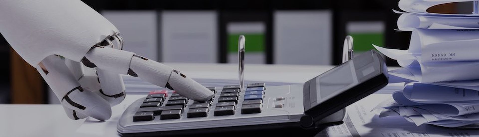 Close-up Of A Robotic Hand Using Calculator