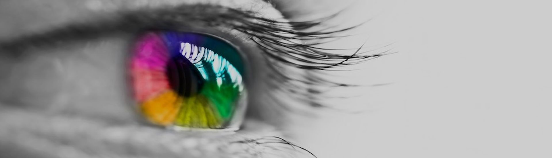 Girl colorful and natural rainbow eye on white background