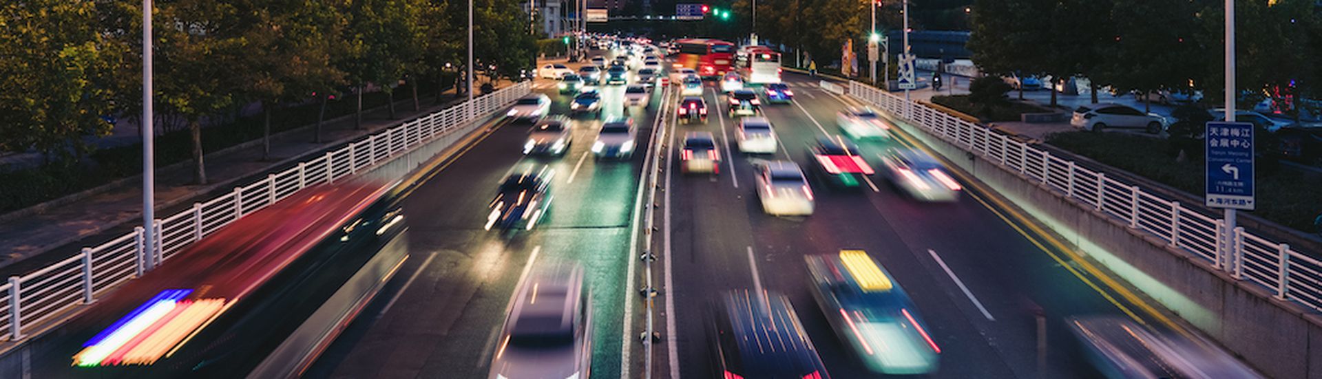 Rush hour traffic on busy highway in downtown financial area in the evening