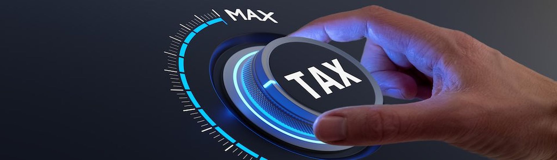 Tax reduction and deduction for businesses and individuals. Concept with hand turning knob to low taxation rate. Return form, exemptions, incentives.