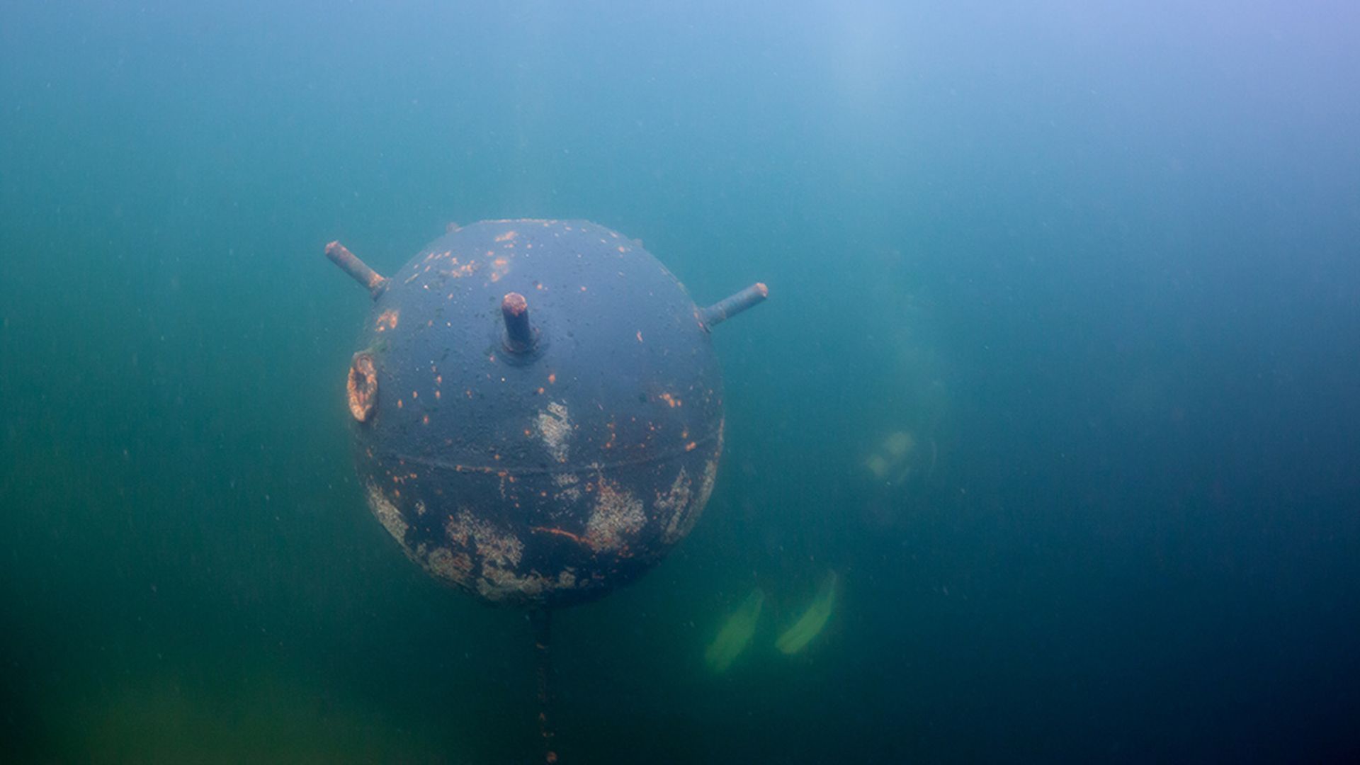 Old russian Anchor contact mine and scubadiver