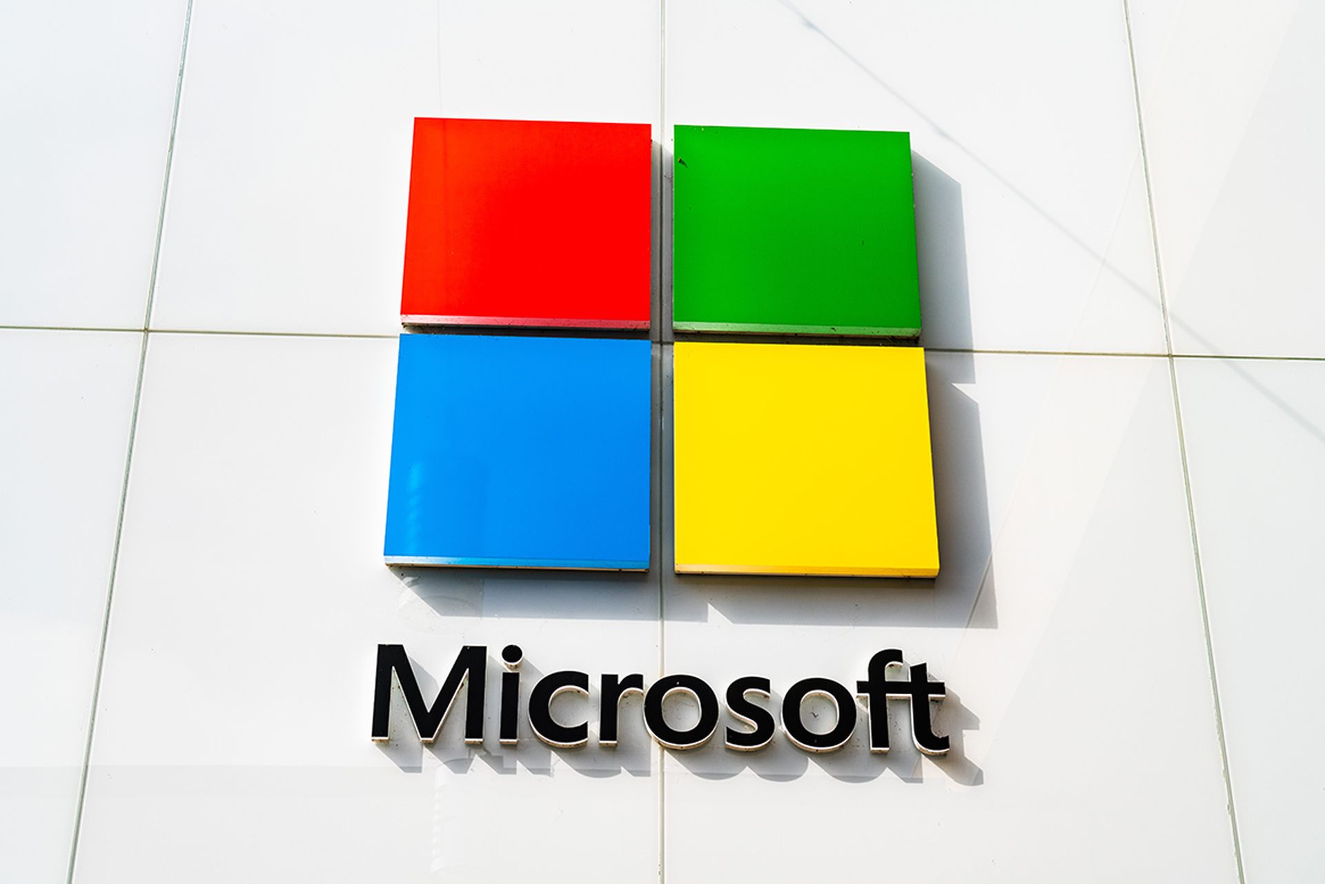 The Microsoft logo is seen on the facade of a store.